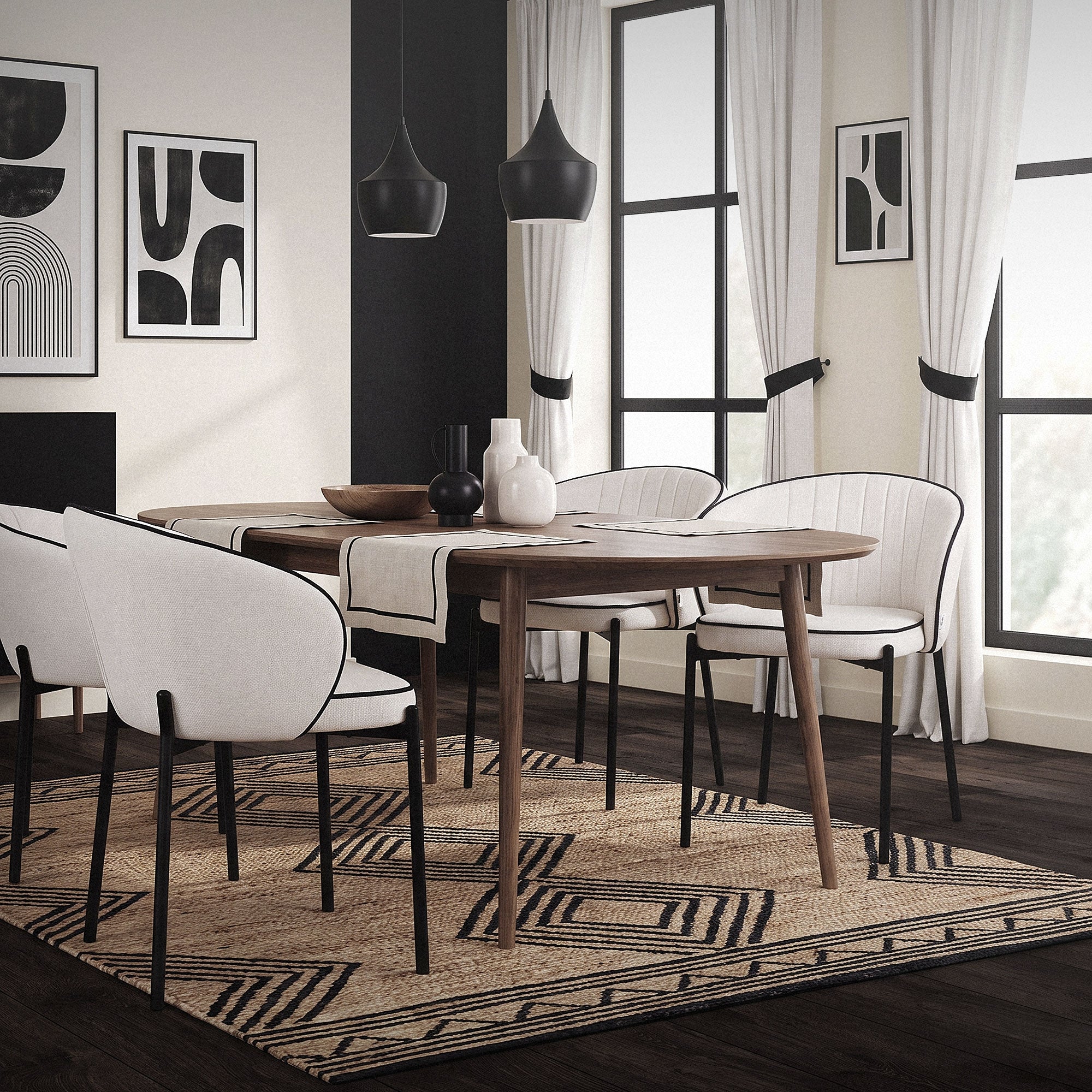 A dining room with a round table and four chairs, surrounded by windows.