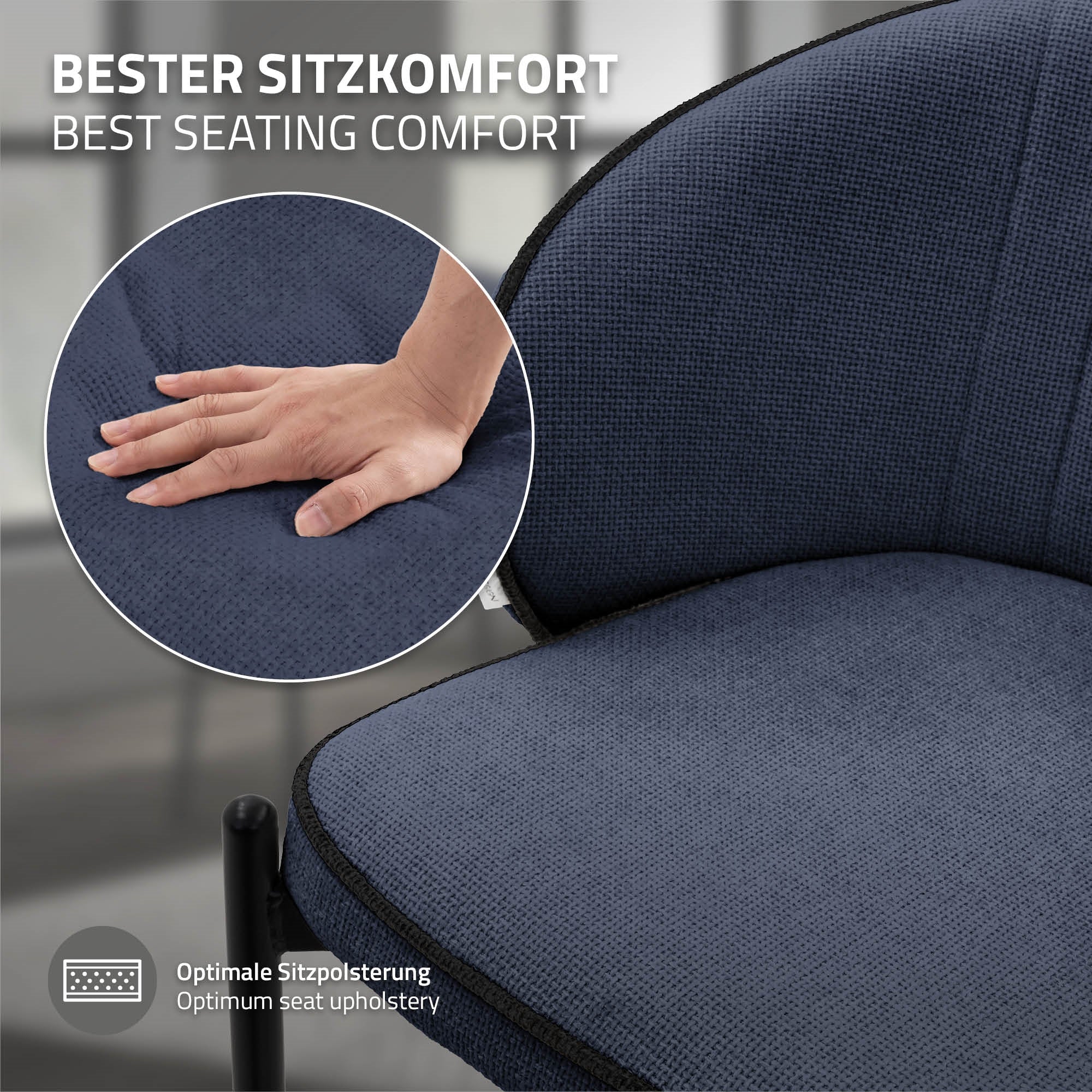 Nahaufnahme einer Hand auf einem blauen Polsterstuhl.