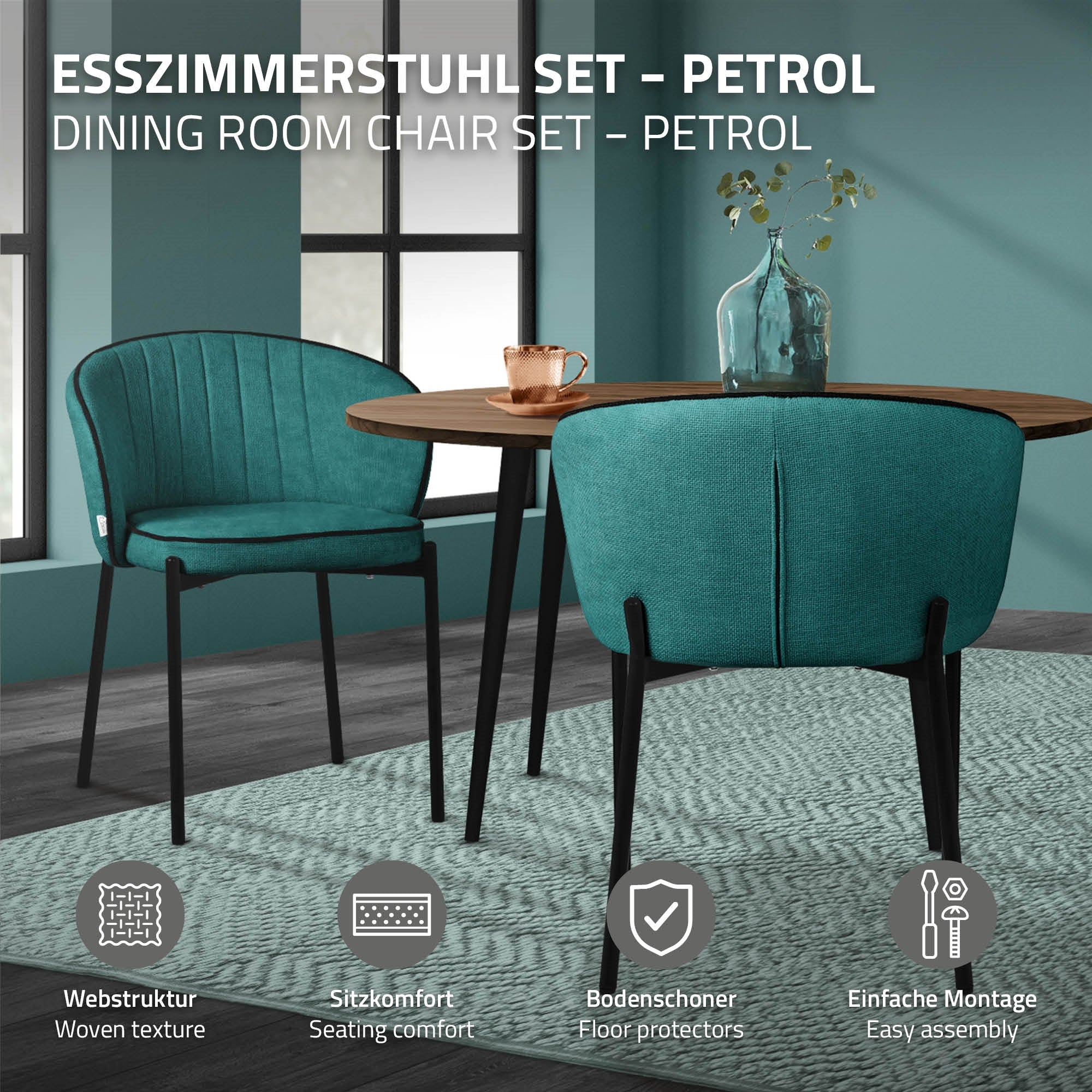 Two chairs in petrol-colored fabric are placed at a table.