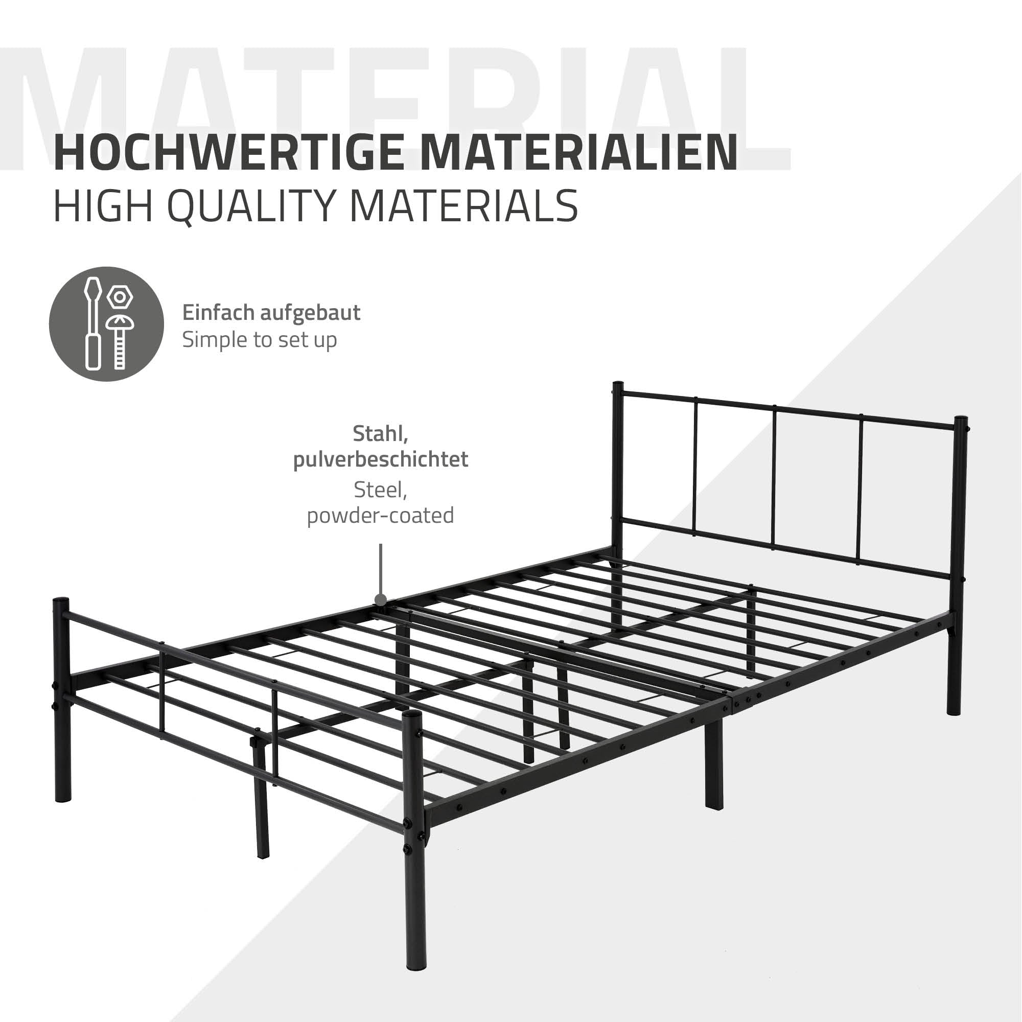 Schwarzes Metallbett mit Lattenrost und Kissen auf der Matratze.