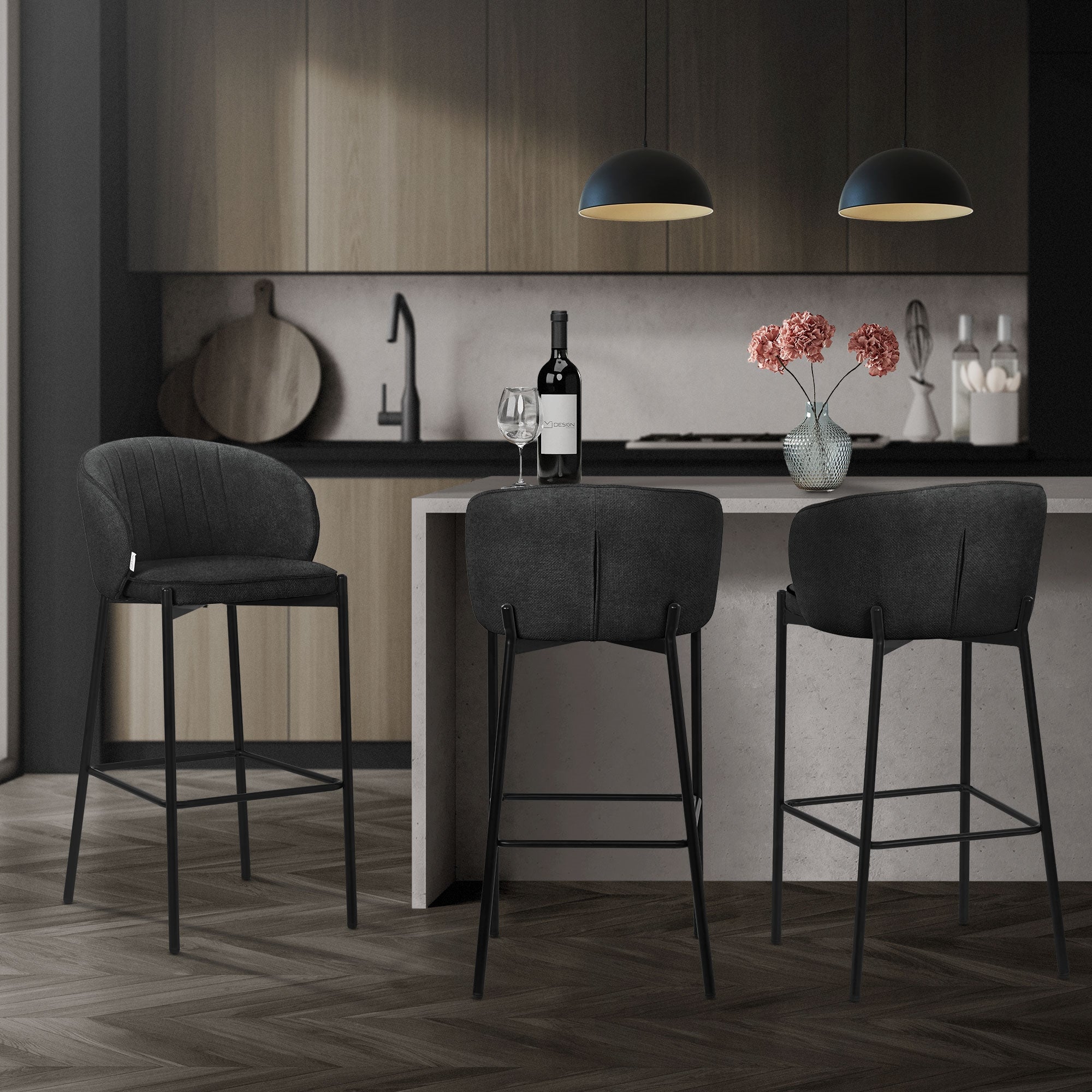 Bar stool in a modern kitchen, with a bottle of wine and flowers on the table.