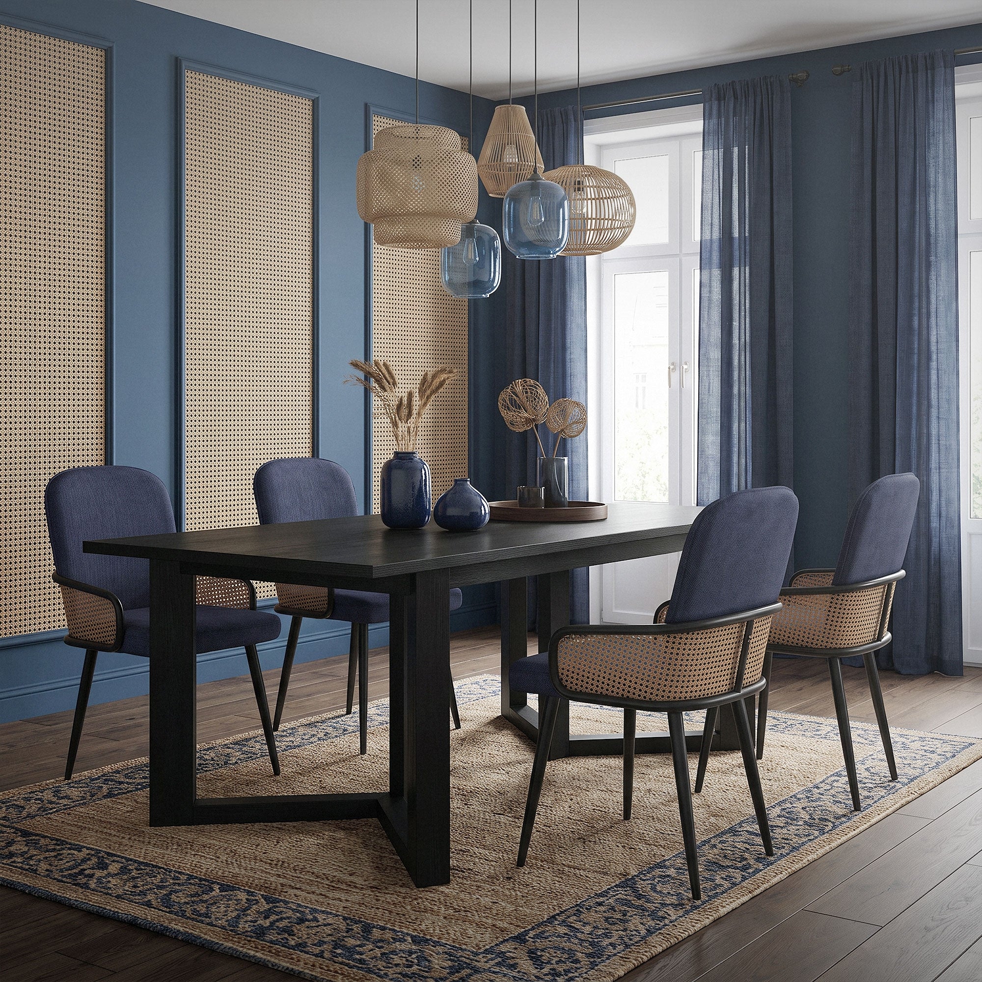 A dining room with a black table, blue chairs, and decorative elements.