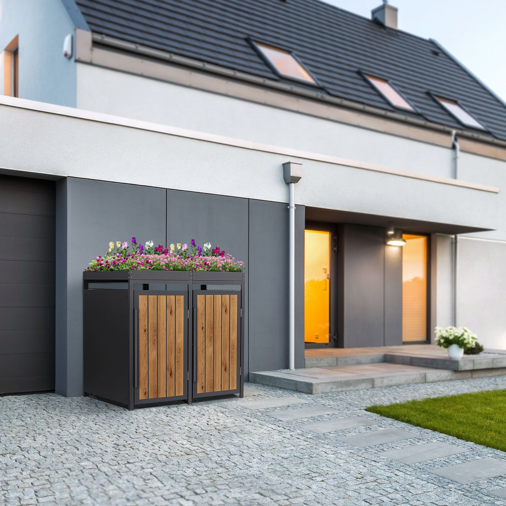 Boîte à poubelles avec des plantes sur le couvercle, devant une maison moderne.