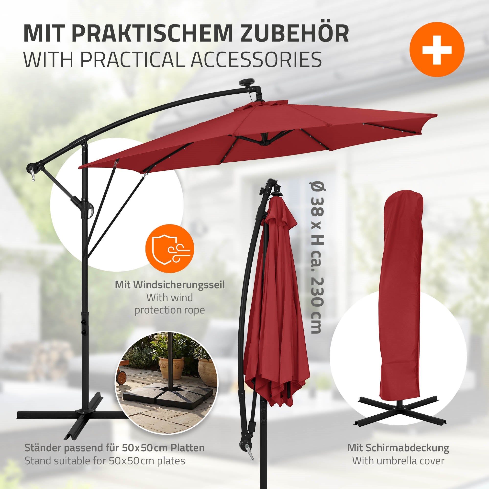 Roter Schirm mit Zubehör, Windschutzseil und Schirmabdeckung.