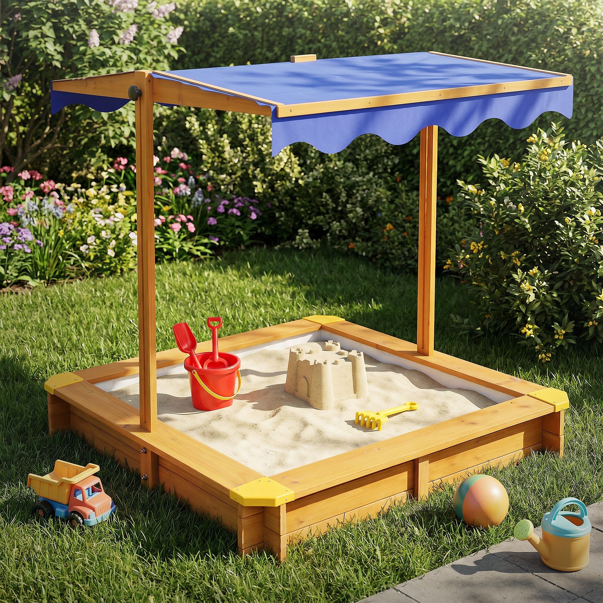 Ein Sandkasten mit Sonnenschutz und Spielzeug im Garten.