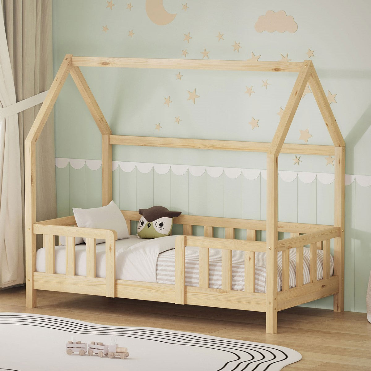 A bed with a roof frame and a pillow in a children's room.