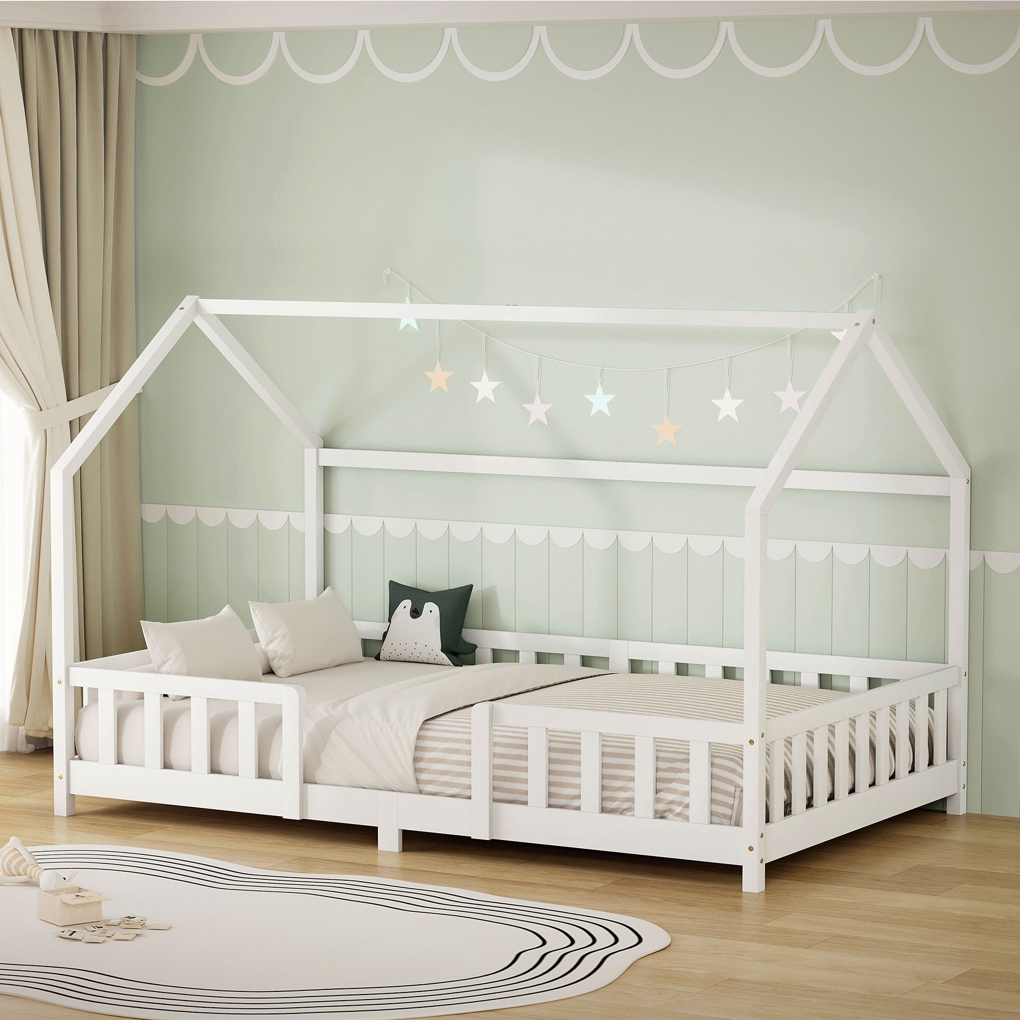 Cama blanca en la habitación infantil con luces de estrellas.
