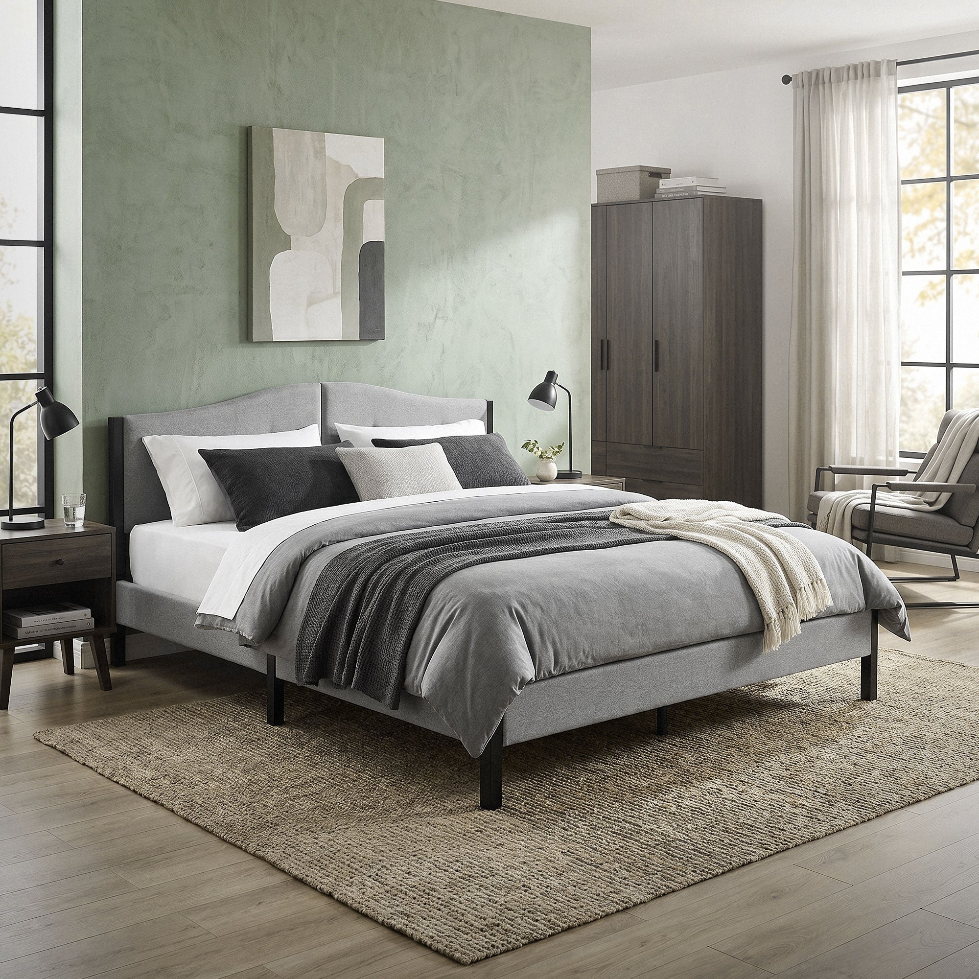 Ein modernes Schlafzimmer mit einem grauen Bett, Kissen und einer Wand mit grüner Farbe.