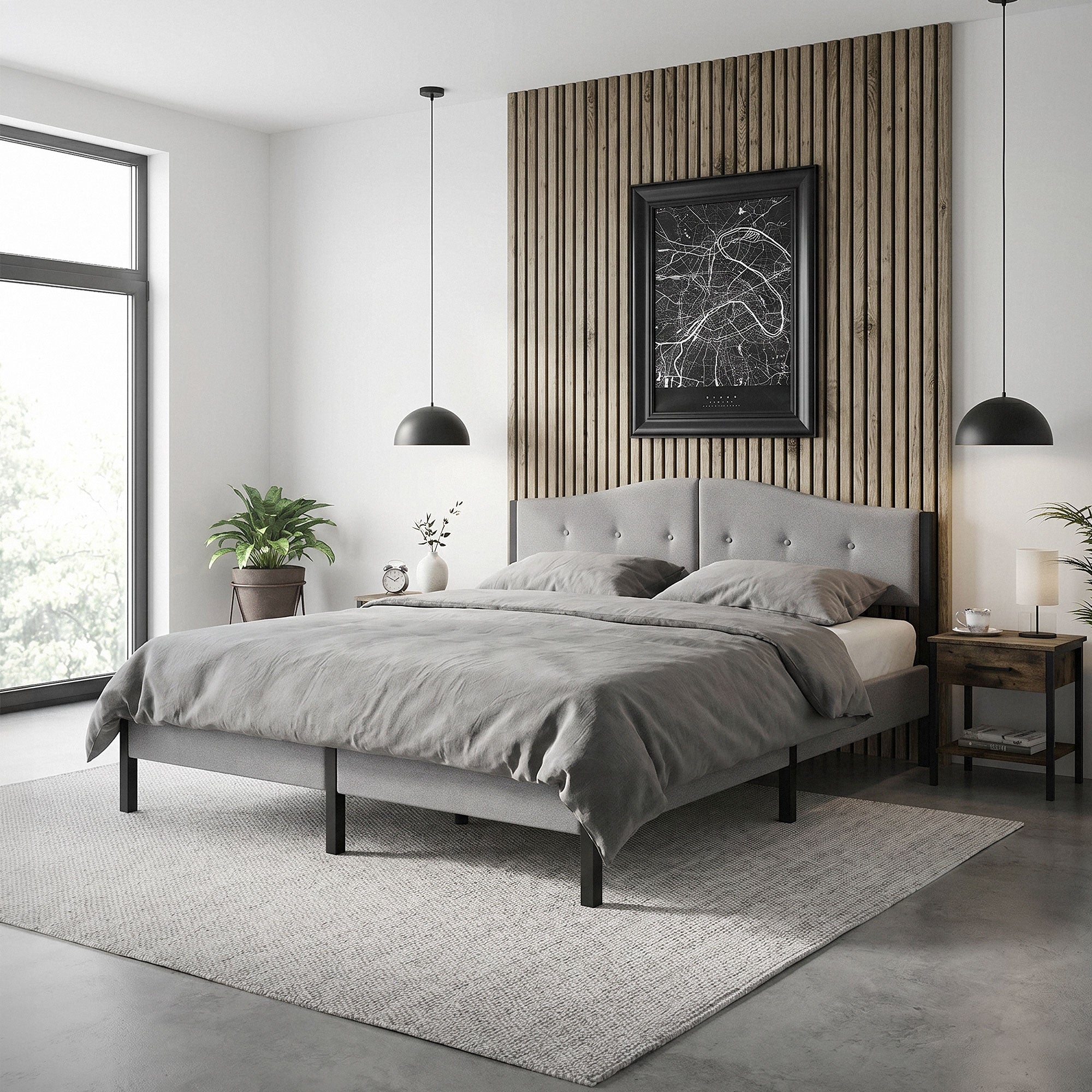 Bedroom with gray bed, wooden paneling, and plants in the room.