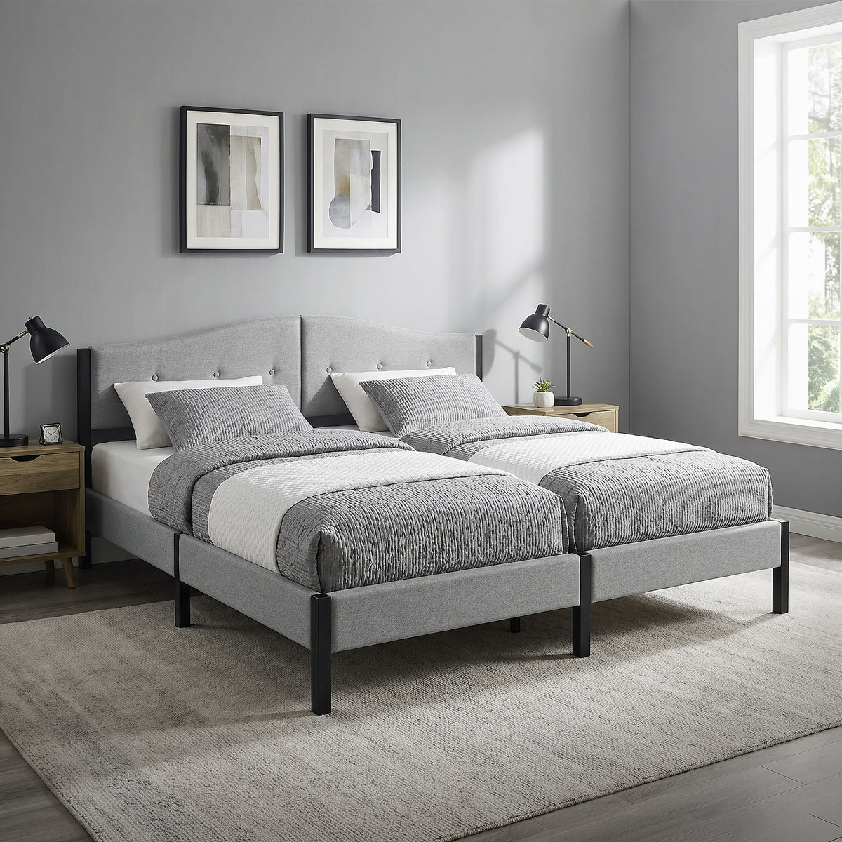 Two single beds with gray bedding in a modern bedroom.