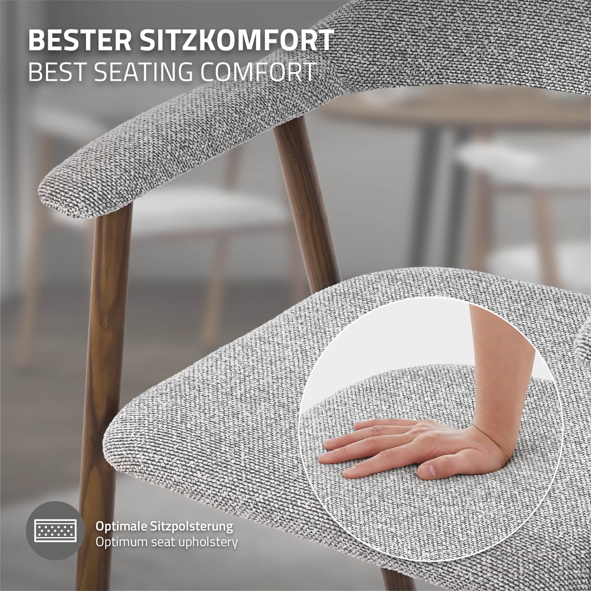 Nahaufnahme einer Hand auf einem gepolsterten Stuhlarm.