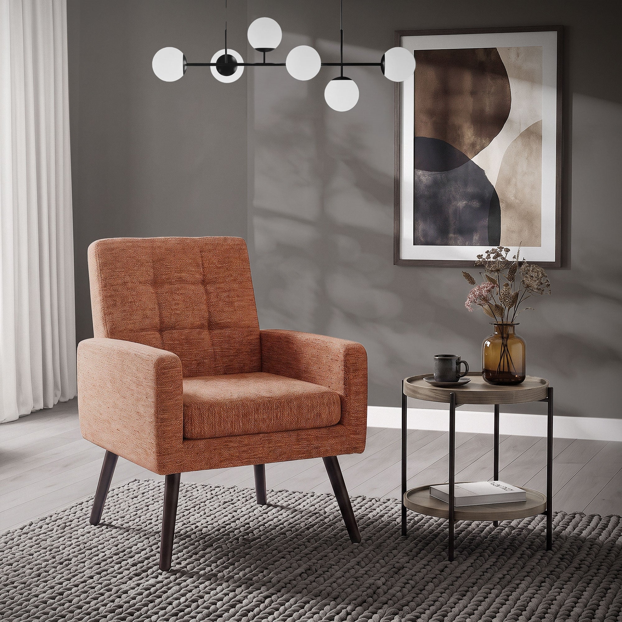 Sillón acogedor en naranja junto a una mesa pequeña en una habitación moderna.