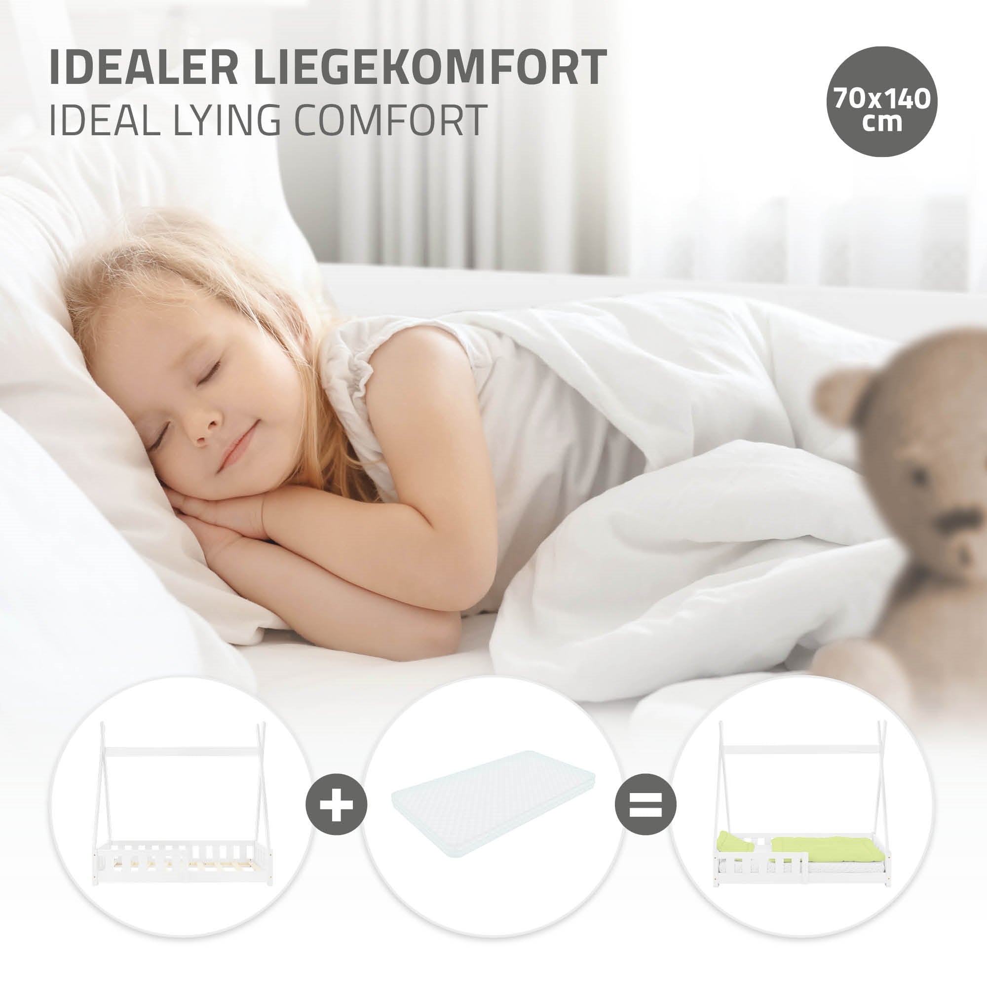 Ein schlafendes Kind auf einer Matratze mit einem weißen Kinderbett.