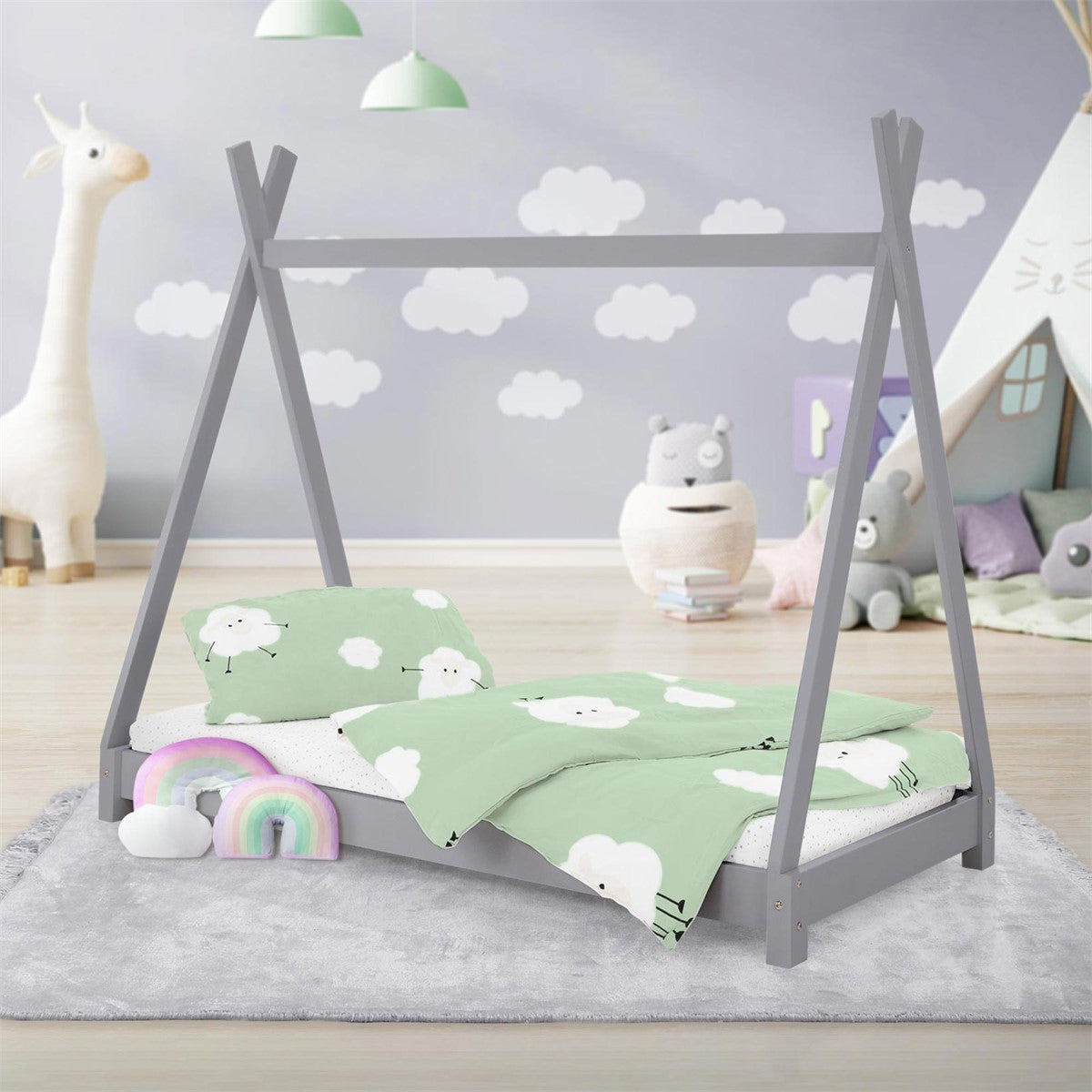 A children's bed in a tent design with cloud bedding and toys in a bright room.