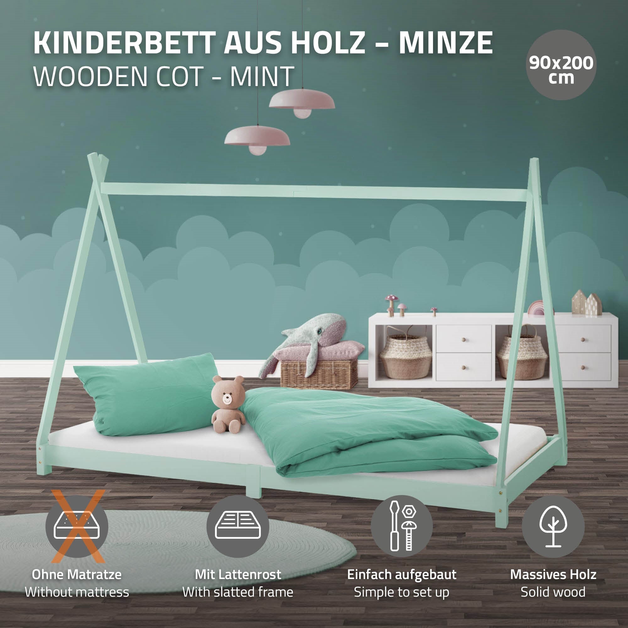 Mintfarbenes Kinderbett aus Holz mit Kissen und Decke.
