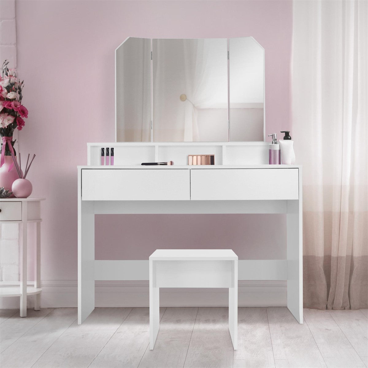 A white dressing table with two drawers and a stool.