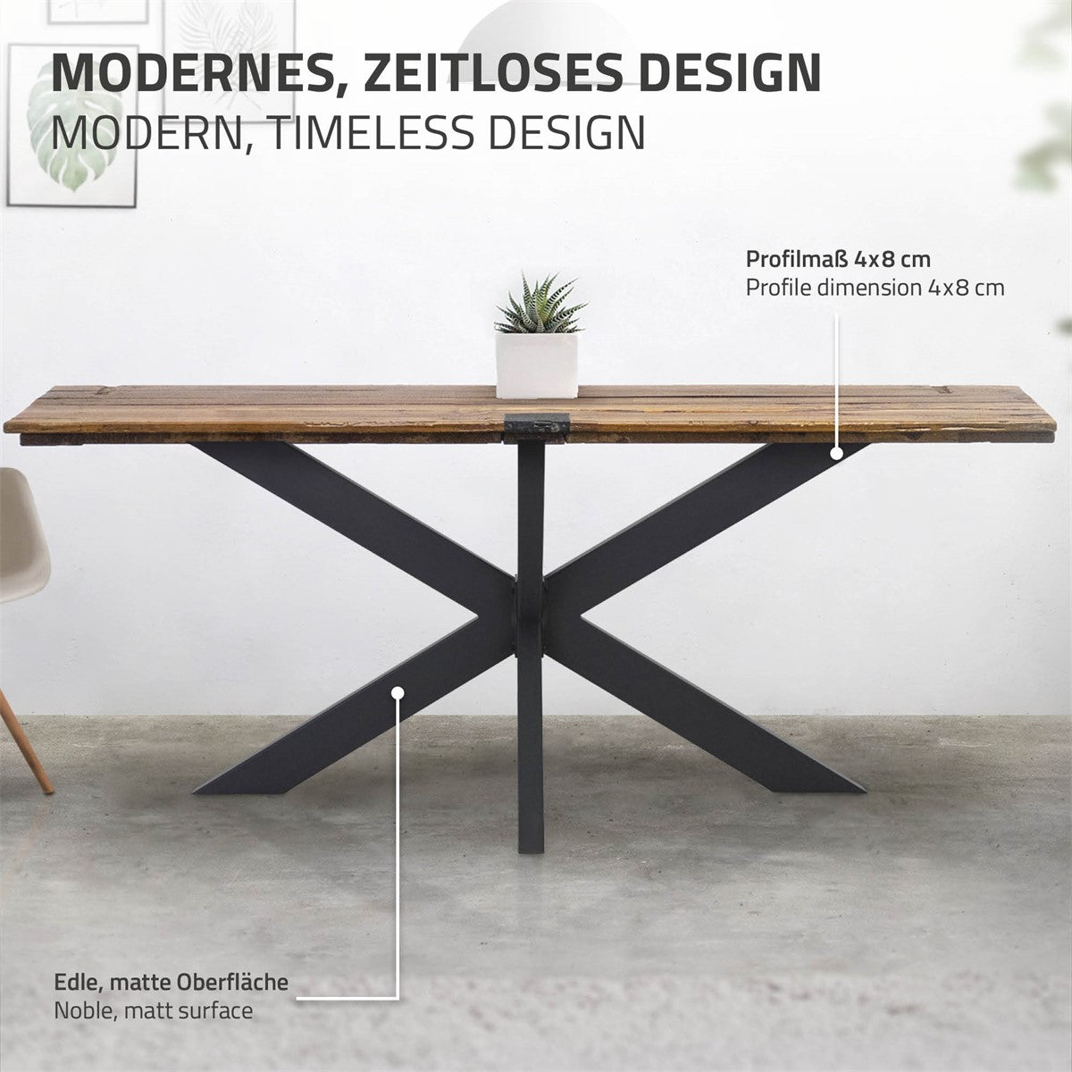 Wooden table with a black metal frame and a plant on the tabletop.