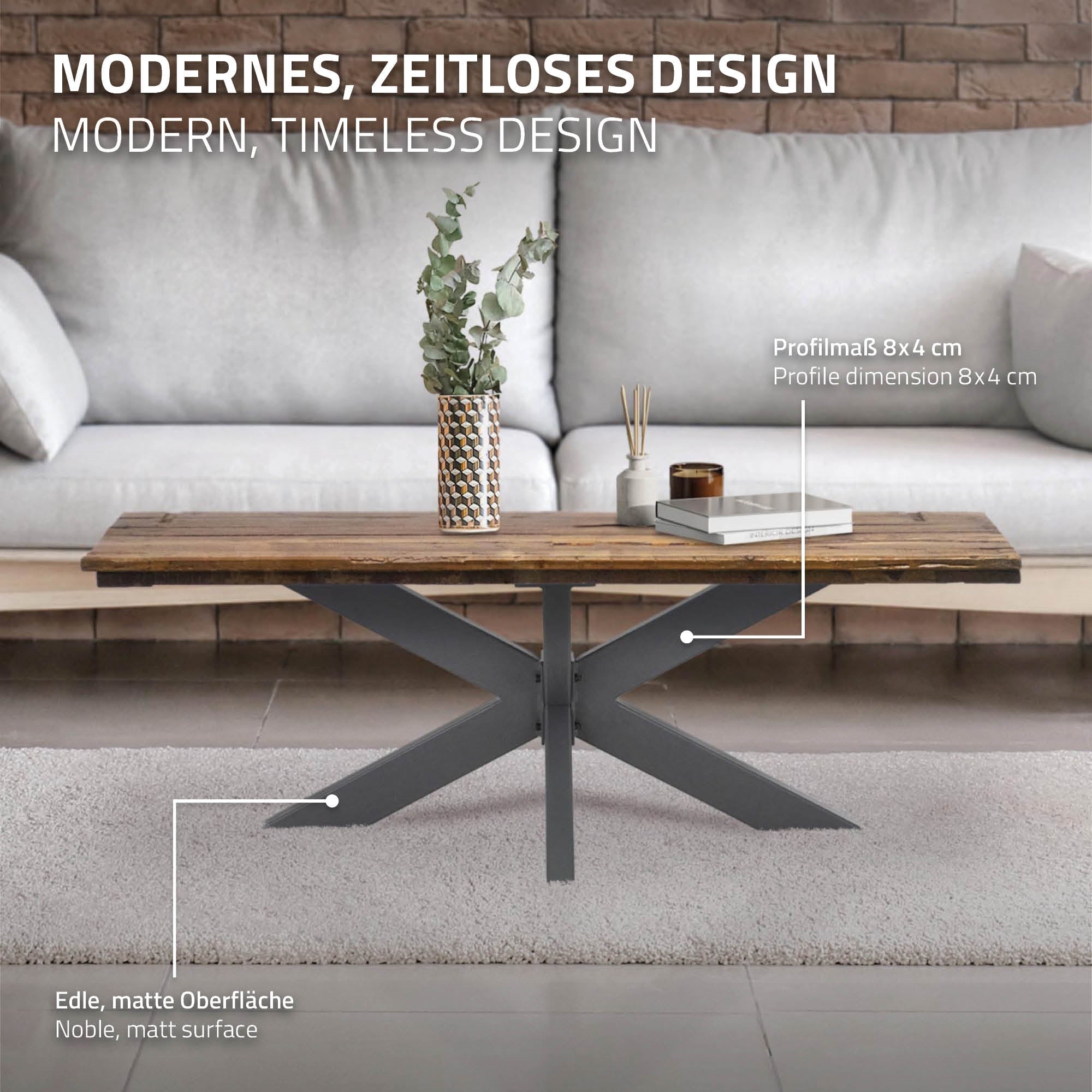Ein Couchtisch mit einer matten Oberfläche und einem modernen Design. Eine Pflanze und ein Buch li