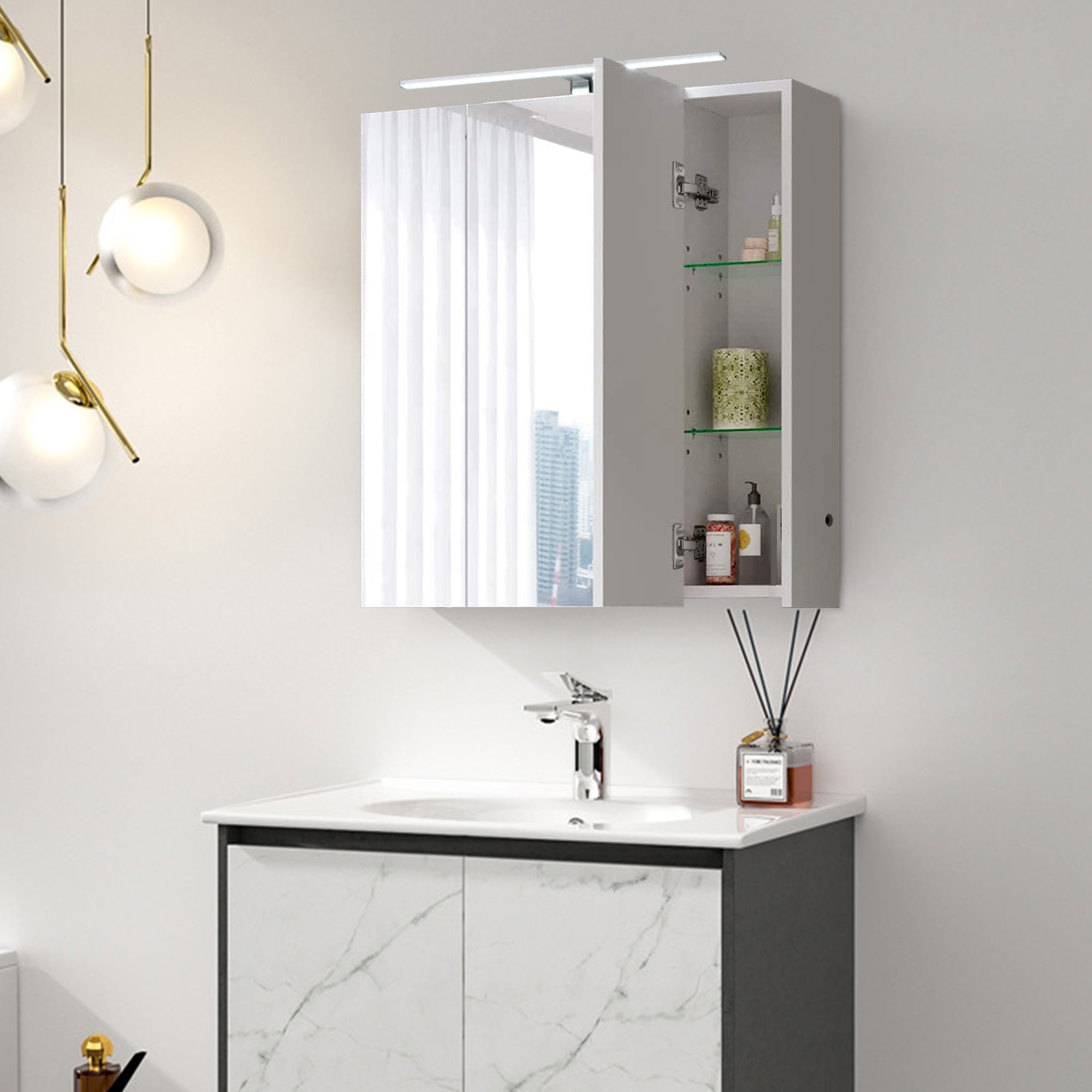 Wall mirror with lighting and open cabinet with care products.