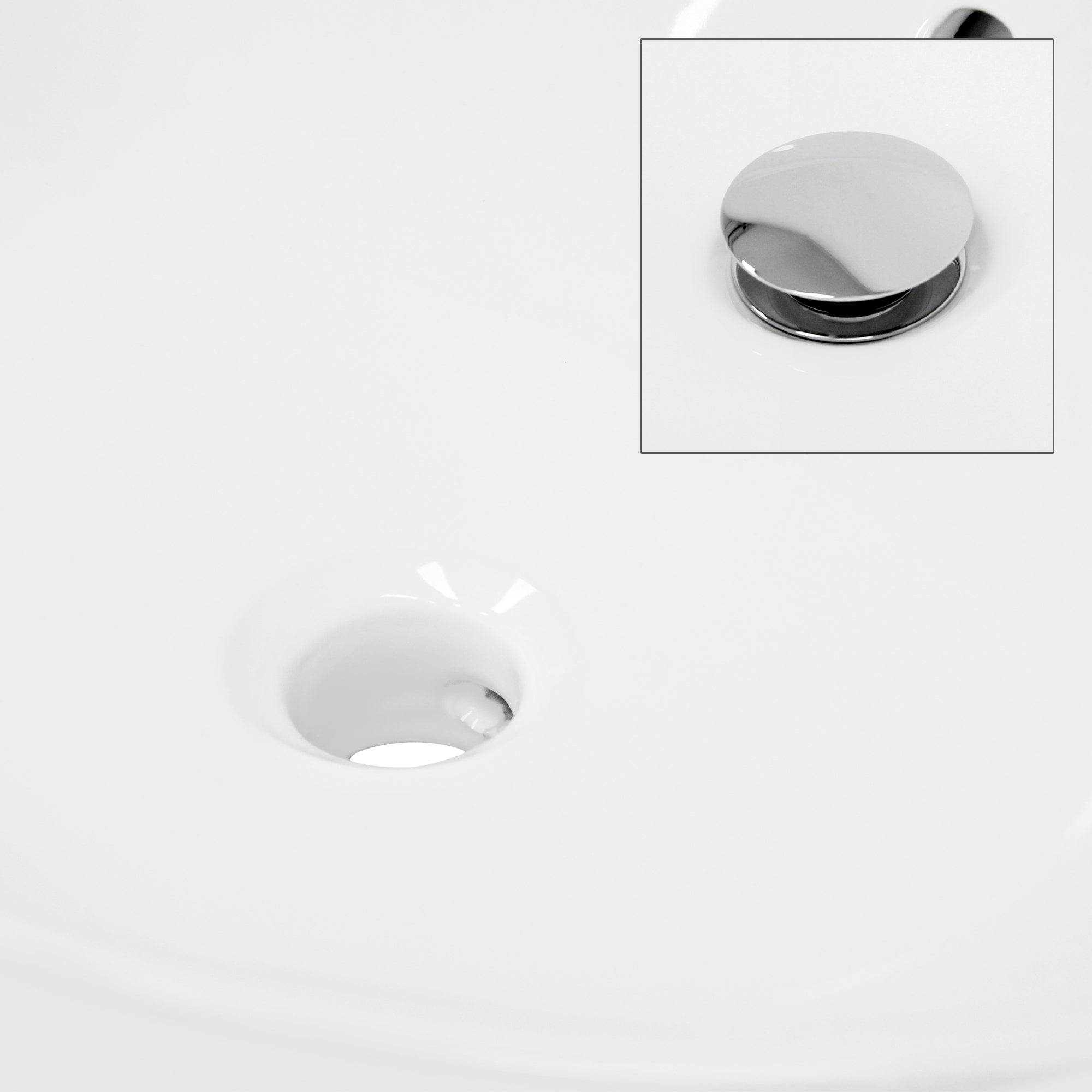Close-up of a sink with drain and chrome stopper.