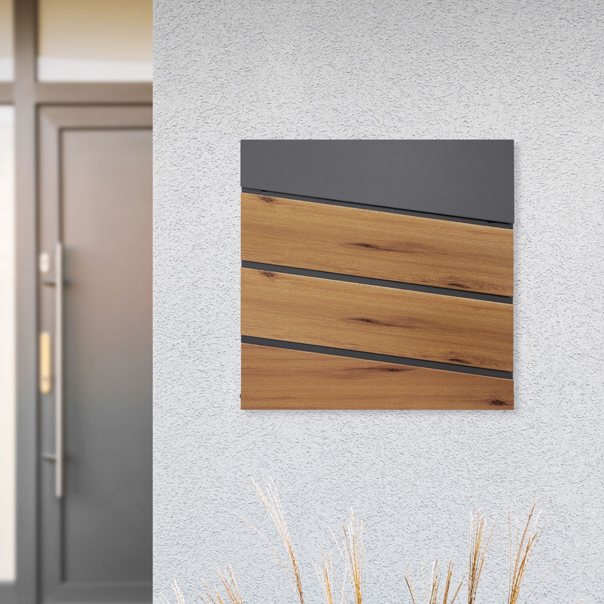 Mailbox on a wall, with three wooden panels and a black top.