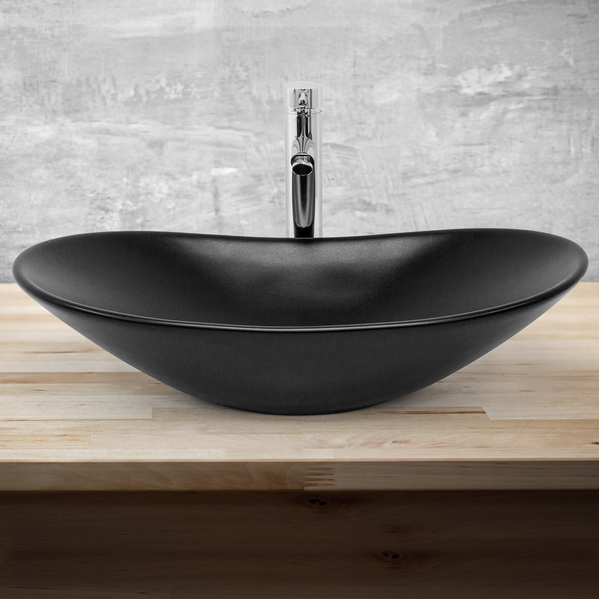 Black sink with modern design on a wooden surface.