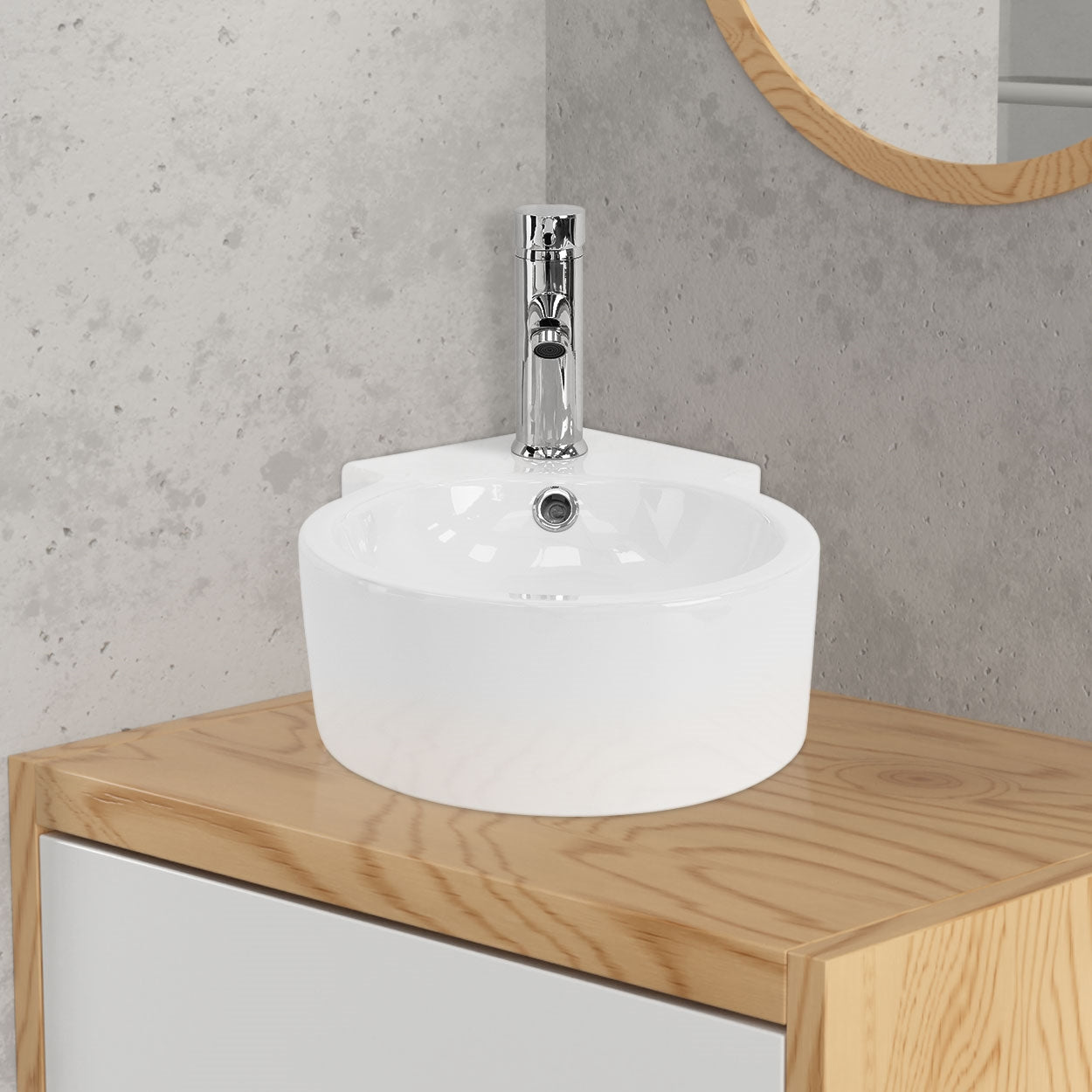 Lavabo rond sur un meuble en bois avec robinet.