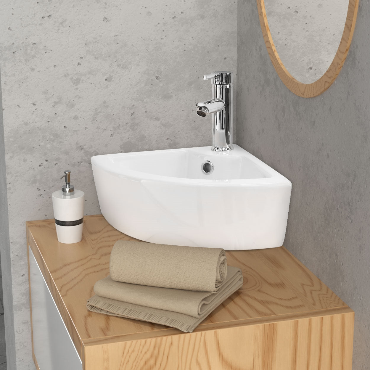 White rectangular sink on a wooden shelf with towels and a cup.