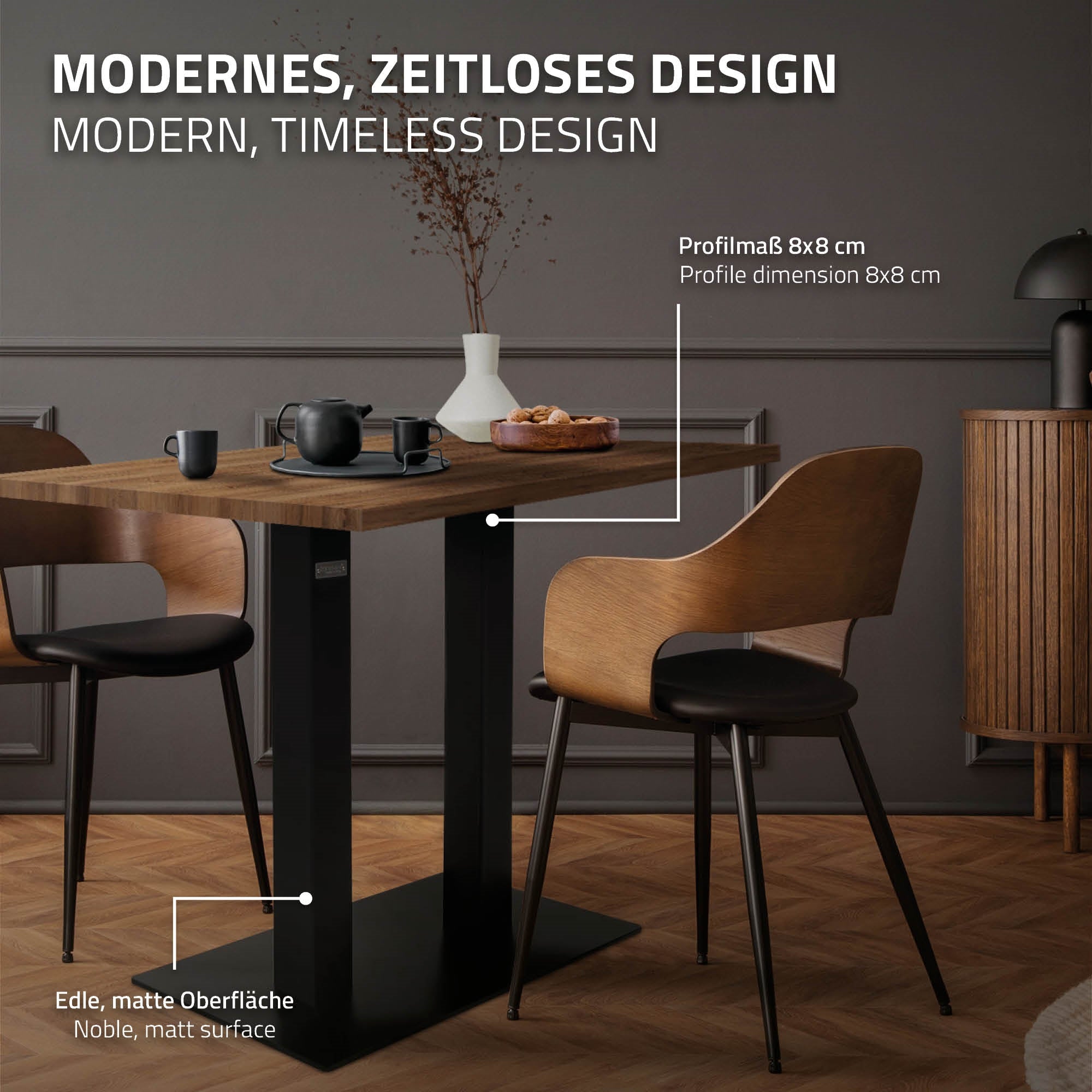 A table with a black base and a wooden top, with cups and a teapot on it.