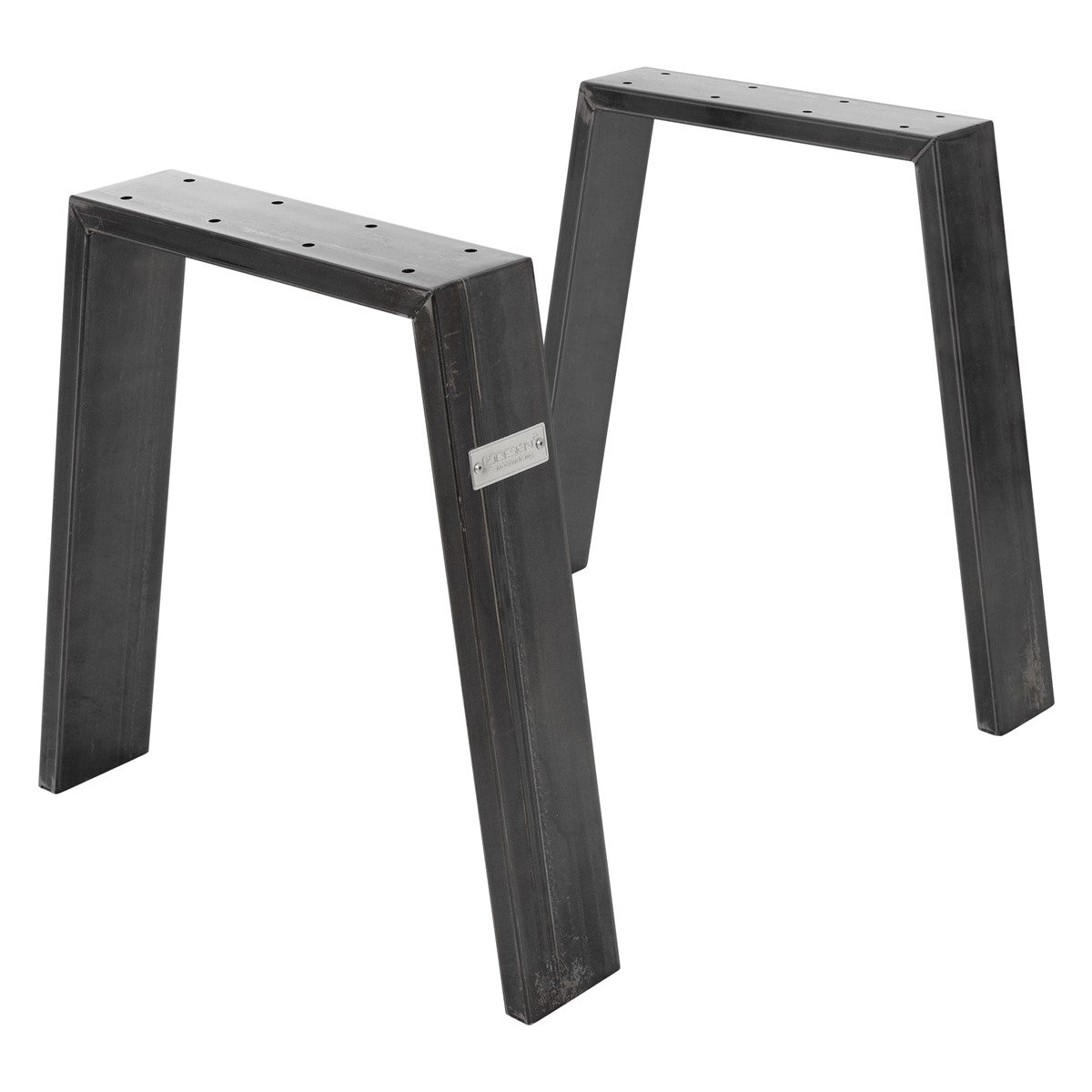 Dos estructuras metálicas negras que sirven como patas de mesa.