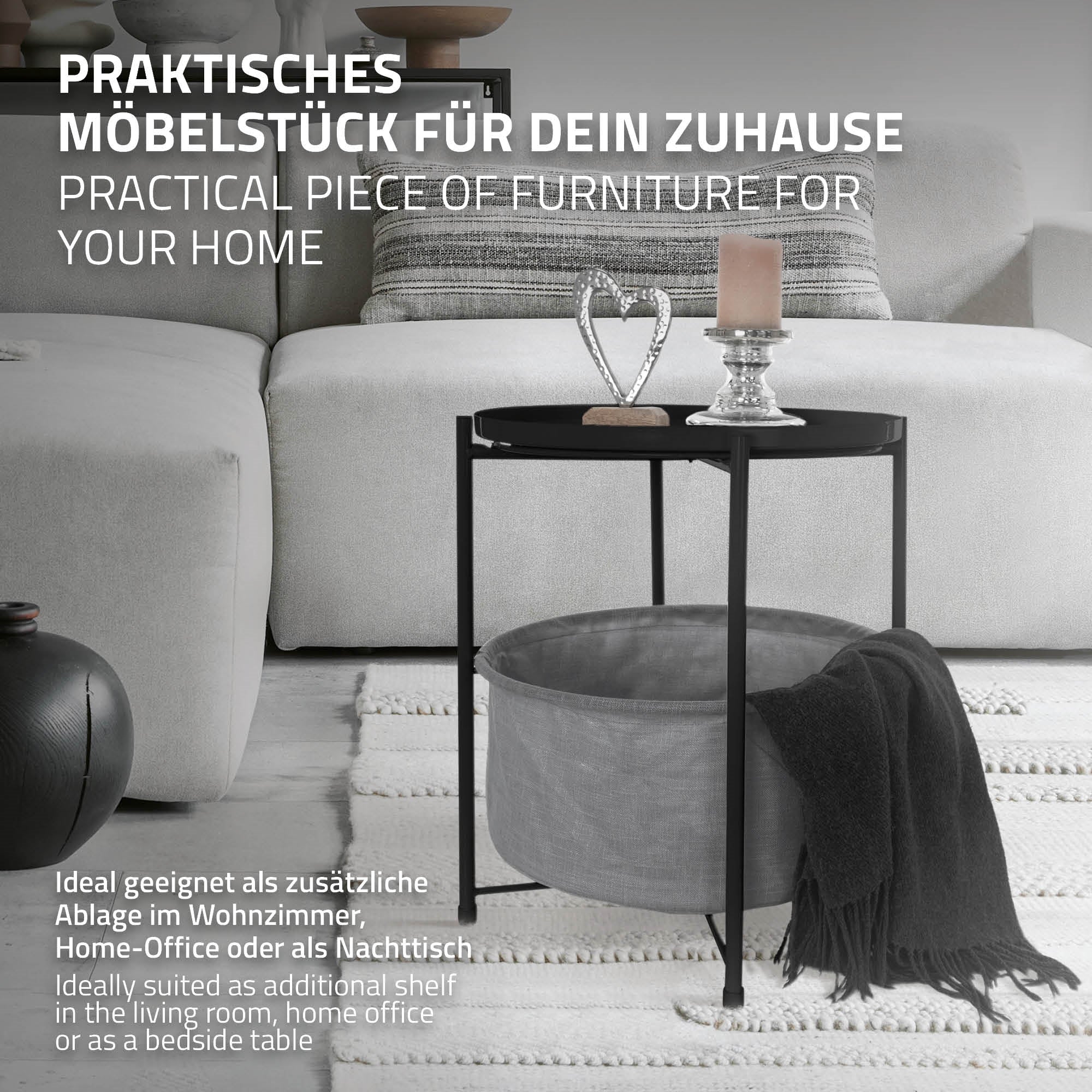 A modern table with a candle and decoration on a light sofa.