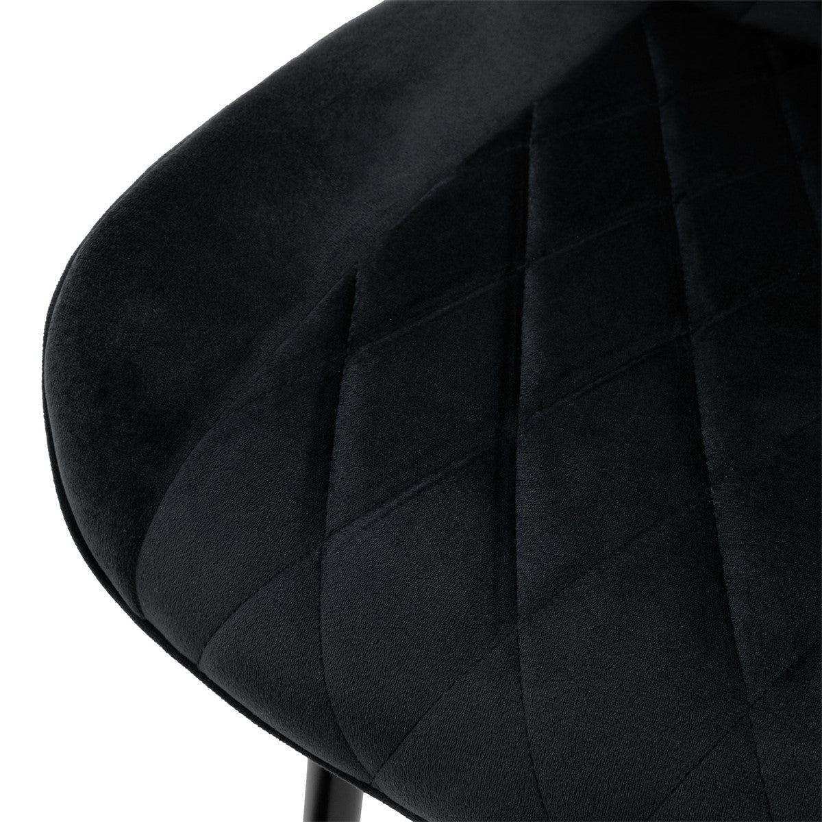 Close-up of the seat of a black chair with diamond-shaped upholstery.