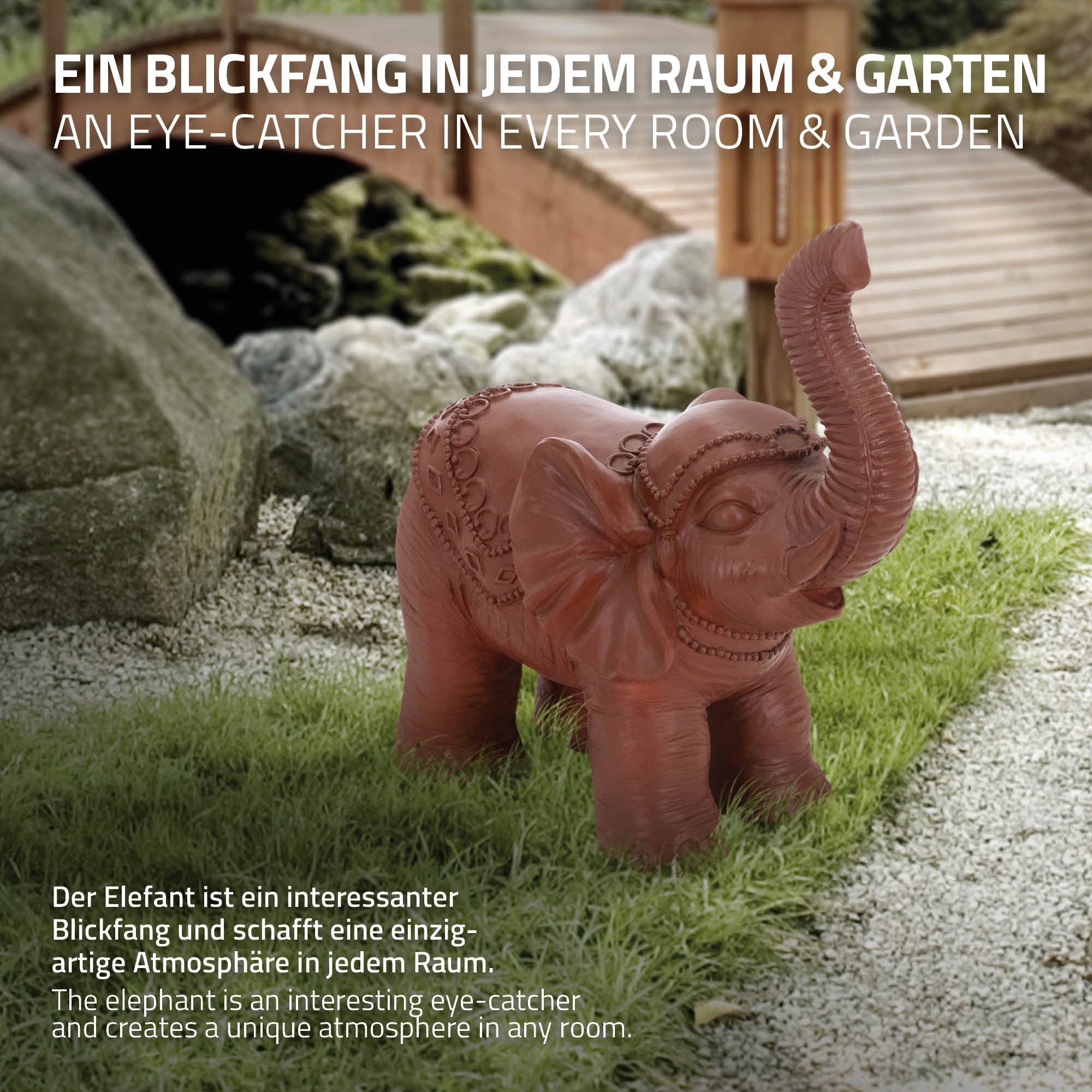 Figura di elefante marrone su prato, circondata da pietre.