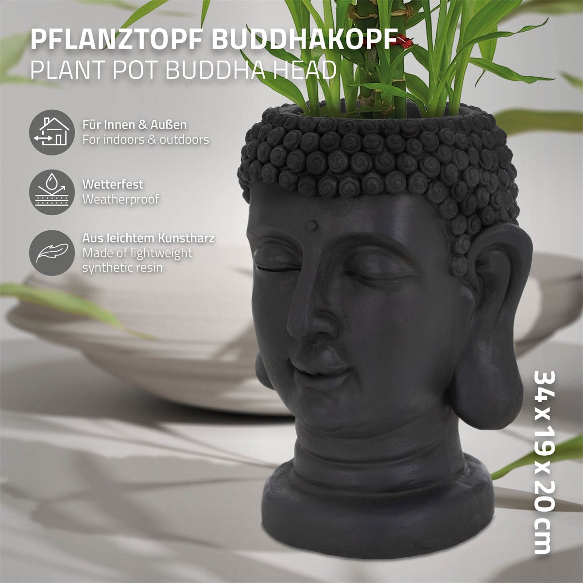Fekete, Buddha-fej formájú virágtartó növényekkel.