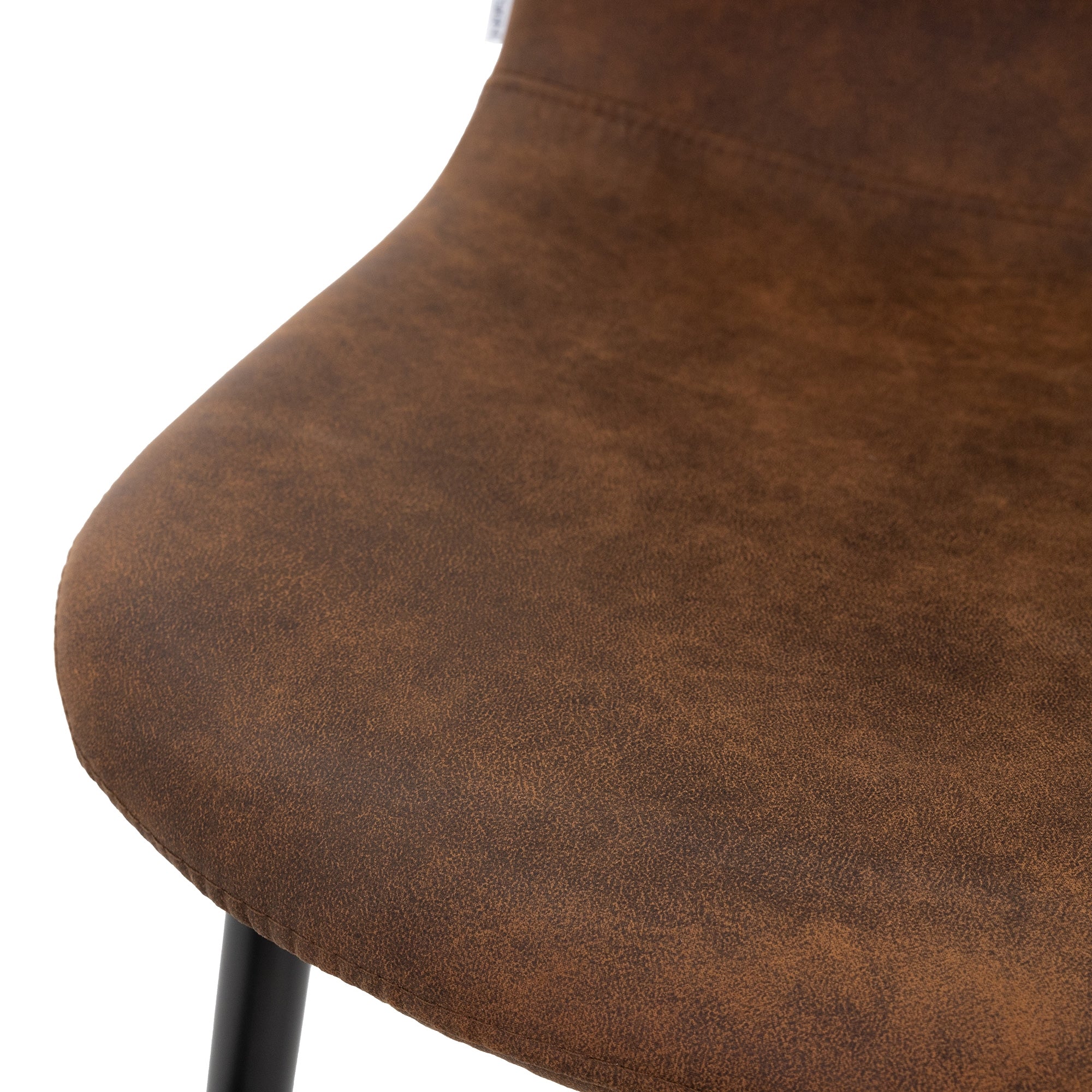 Close-up of the seat of a brown chair.