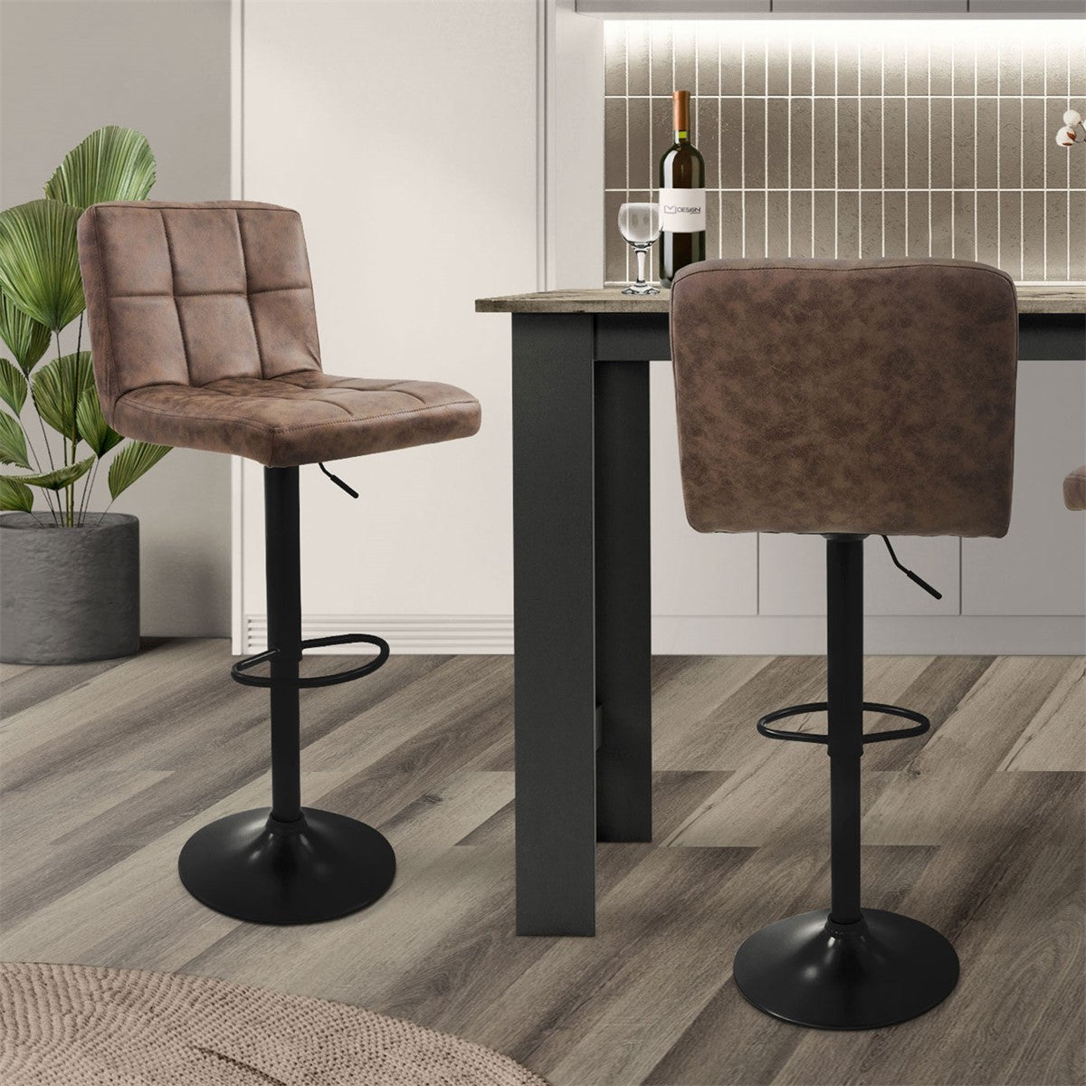 Two bar stools at a table in a modern kitchen with wooden flooring.