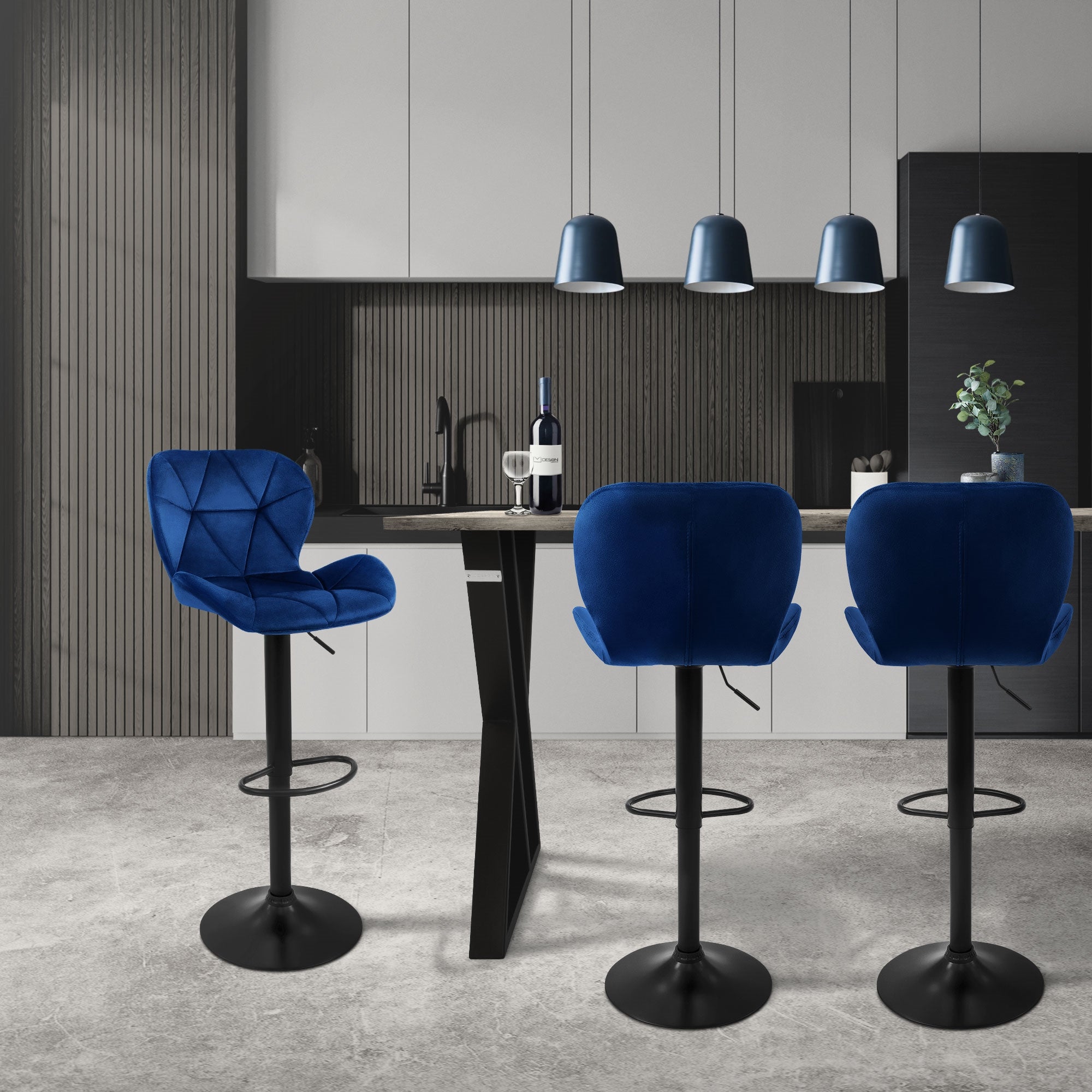 Modern kitchen with three blue bar stools and a counter, illuminated by pendant lights.