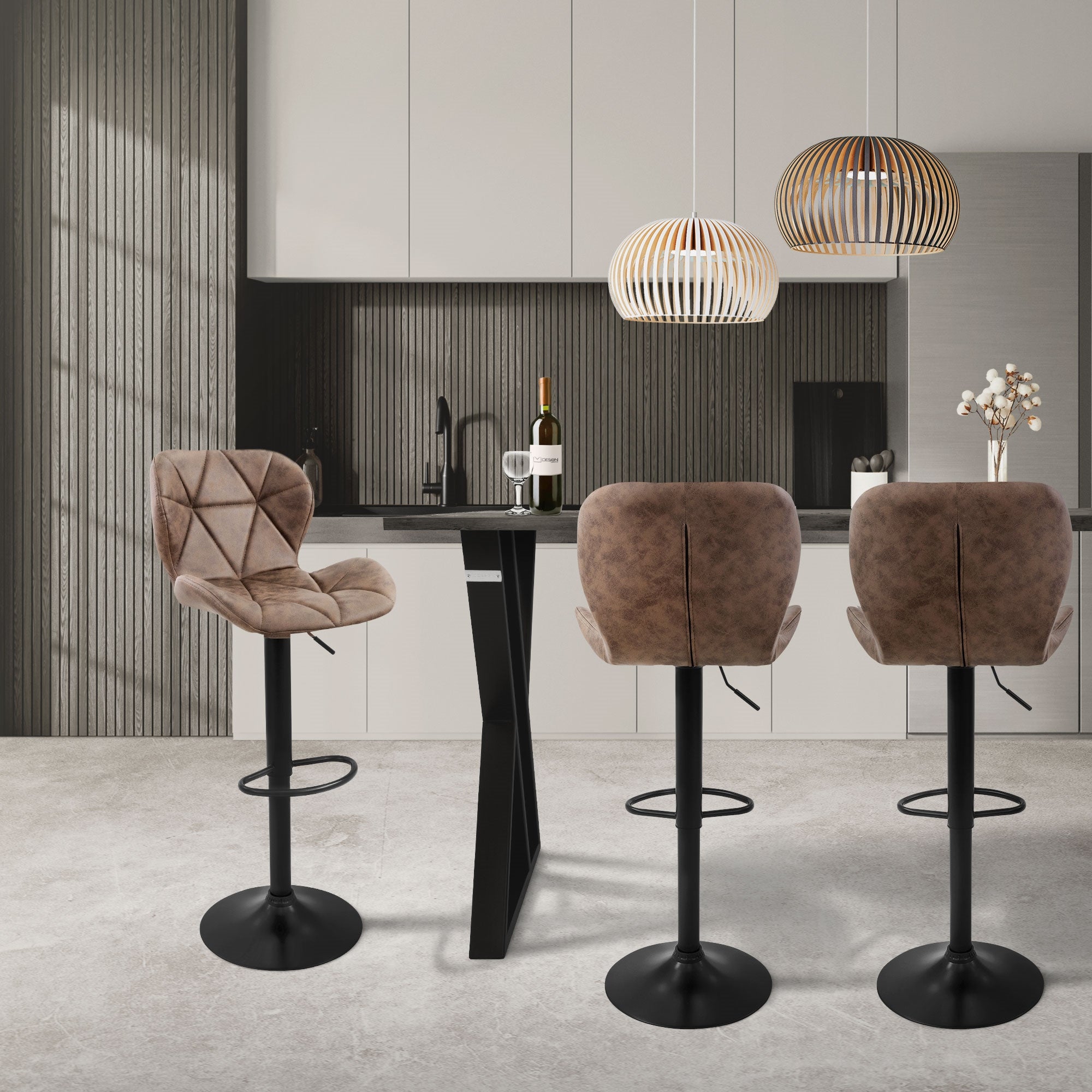 Modern kitchen with brown bar stools at a black counter.