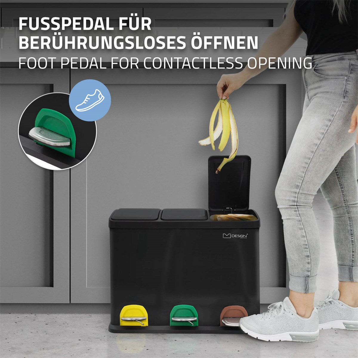 Mülltrennsystem mit Fußpedalen in verschiedenen Farben auf einer Küchenarbeitsplatte.
