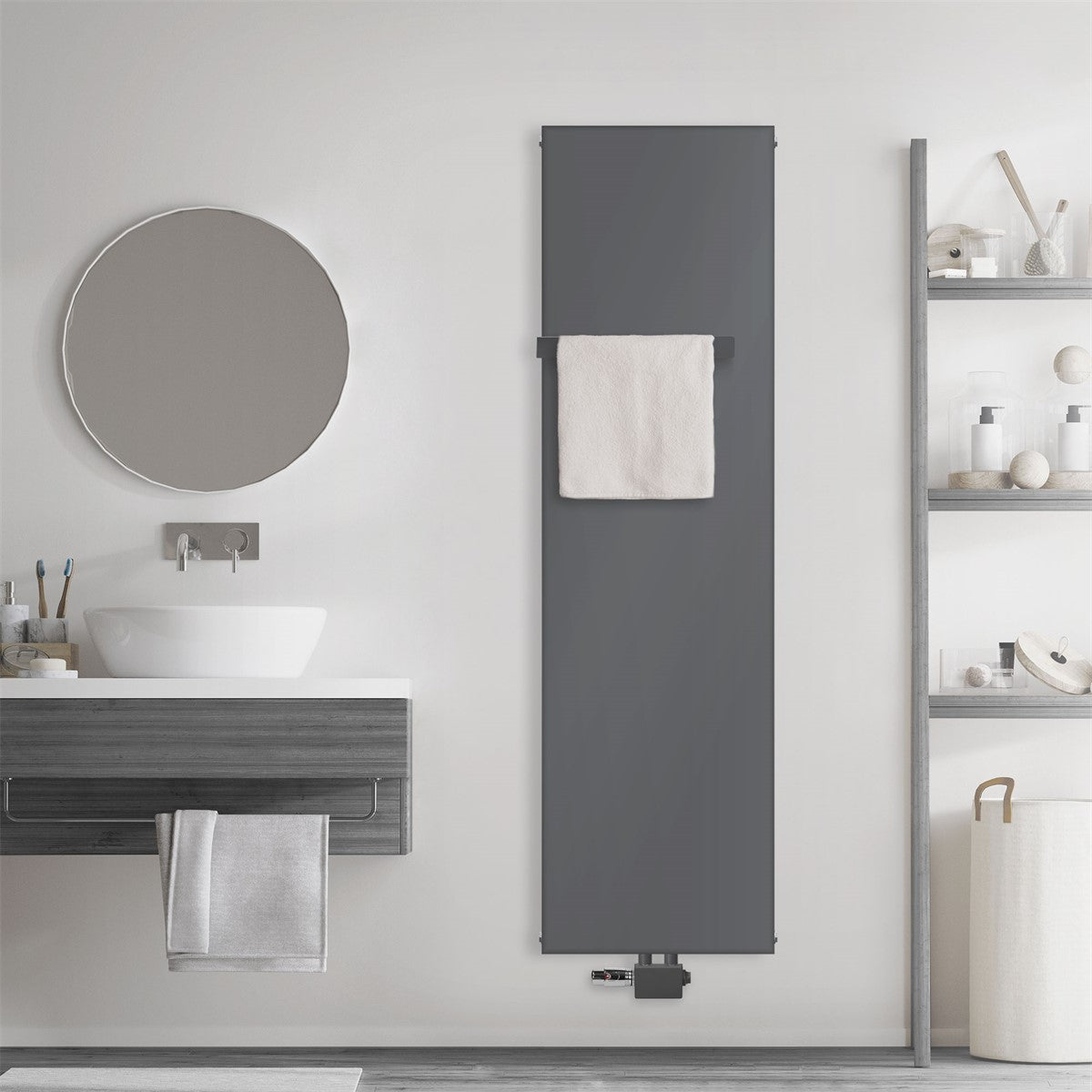 Anthracite-colored radiator on a wall with a towel.