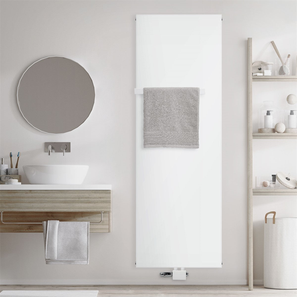 Radiateur blanc avec une serviette grise sur un mur.