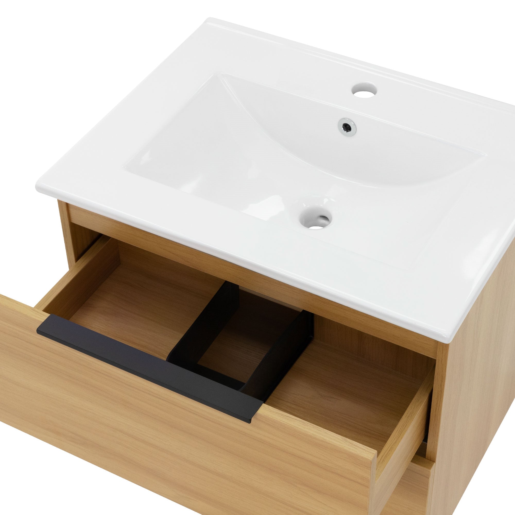 Primer plano de un lavabo con un compartimento de cajón abierto.
