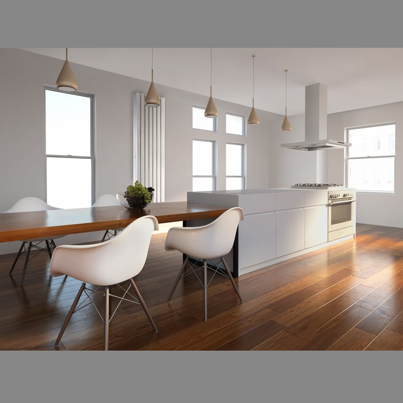 Cocina moderna con suelo de madera, mesa de comedor y radiador.