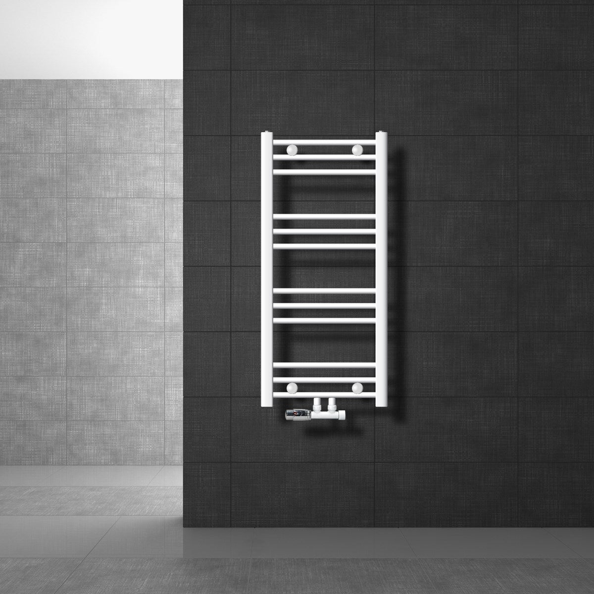 Radiador blanco en una pared oscura de una habitación moderna.