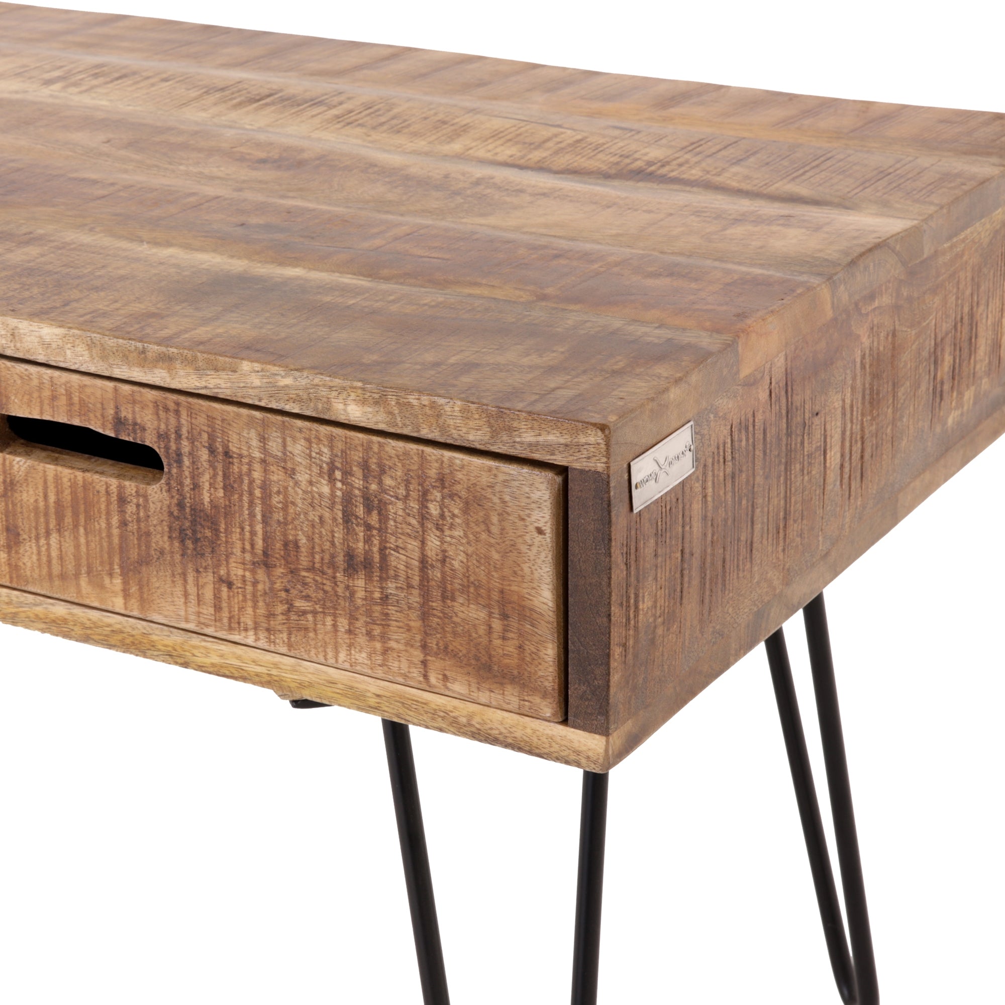 Close-up of a wooden table with a drawer and black table legs.