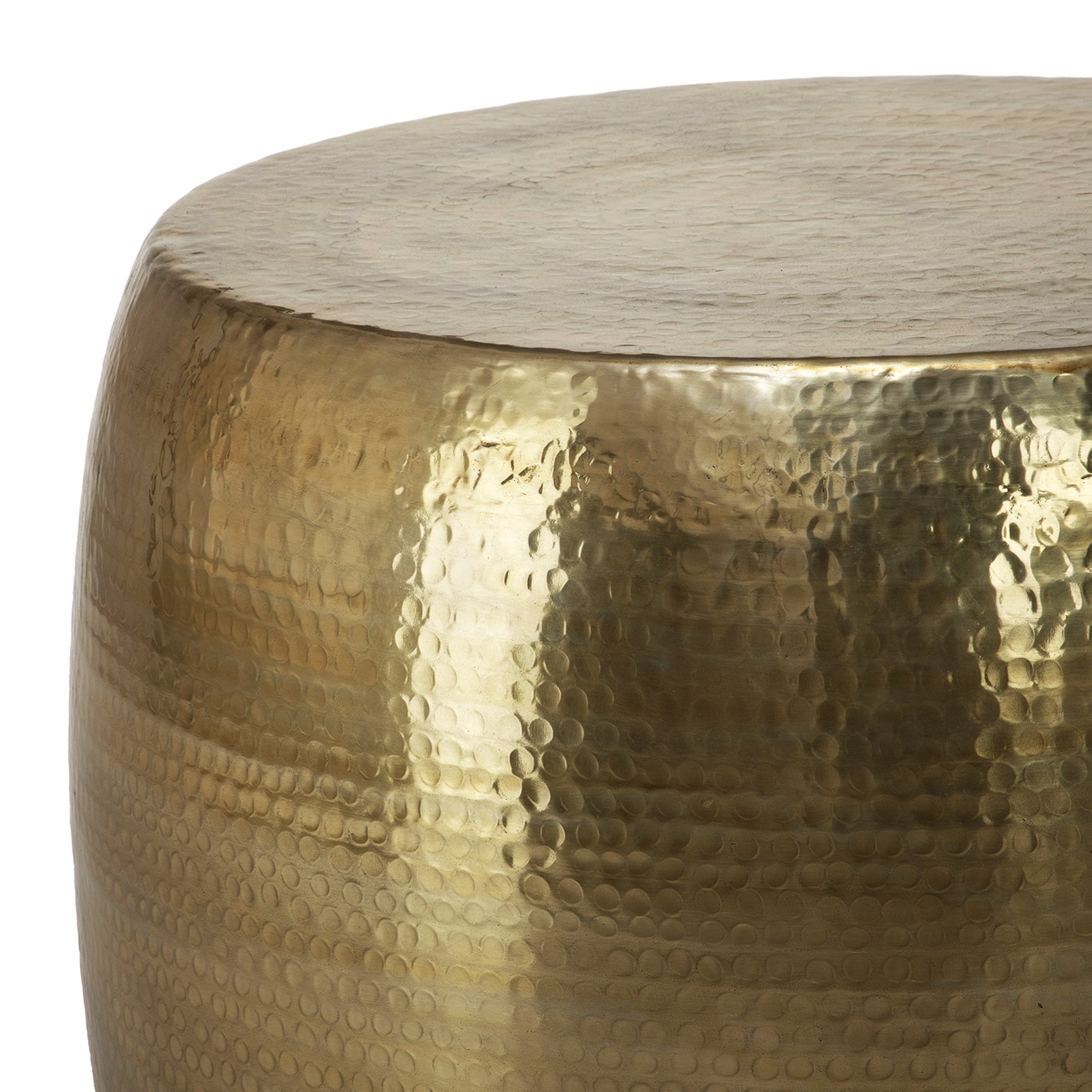 Close-up of a golden, hammered table.