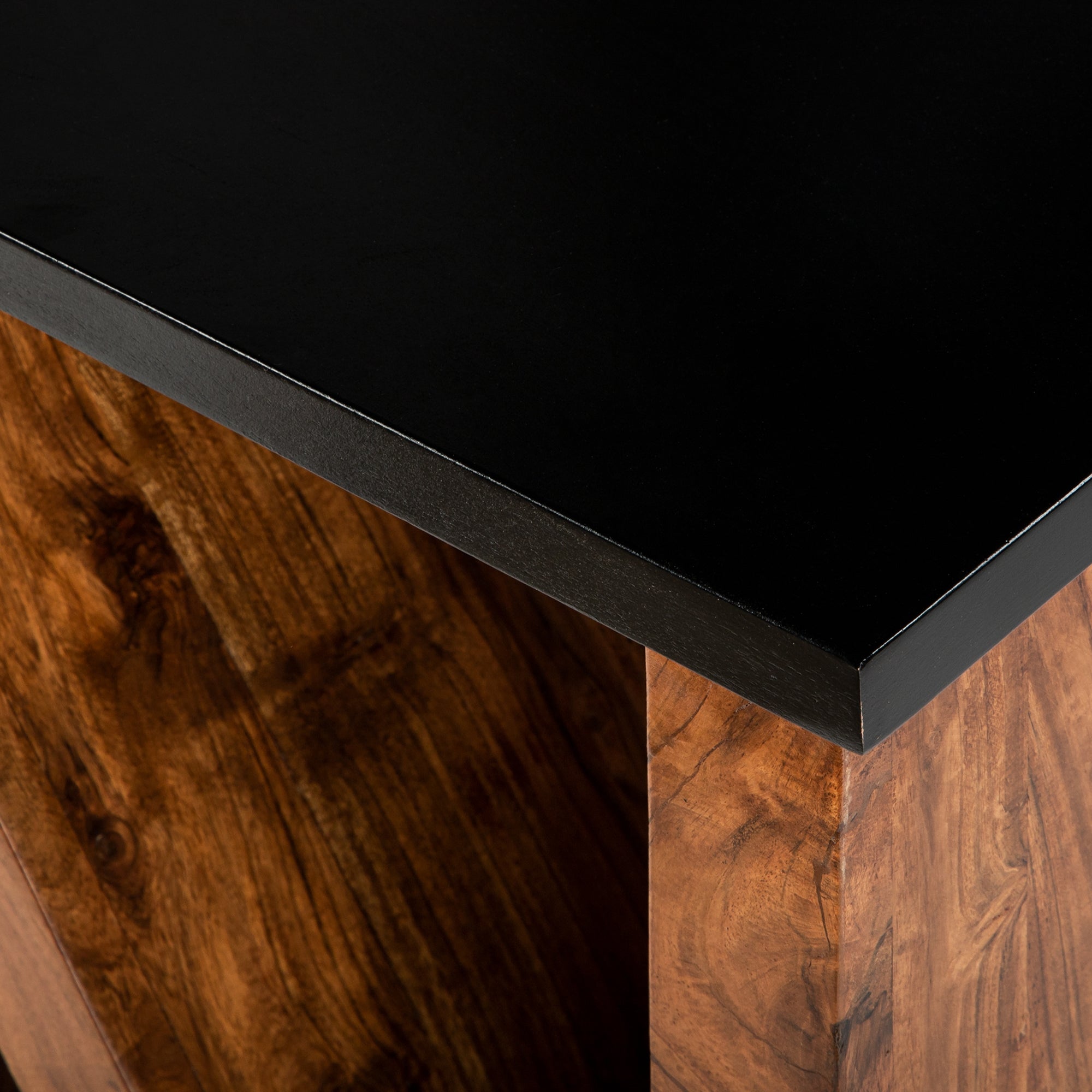 Tabletop made of black material with a wooden substructure.